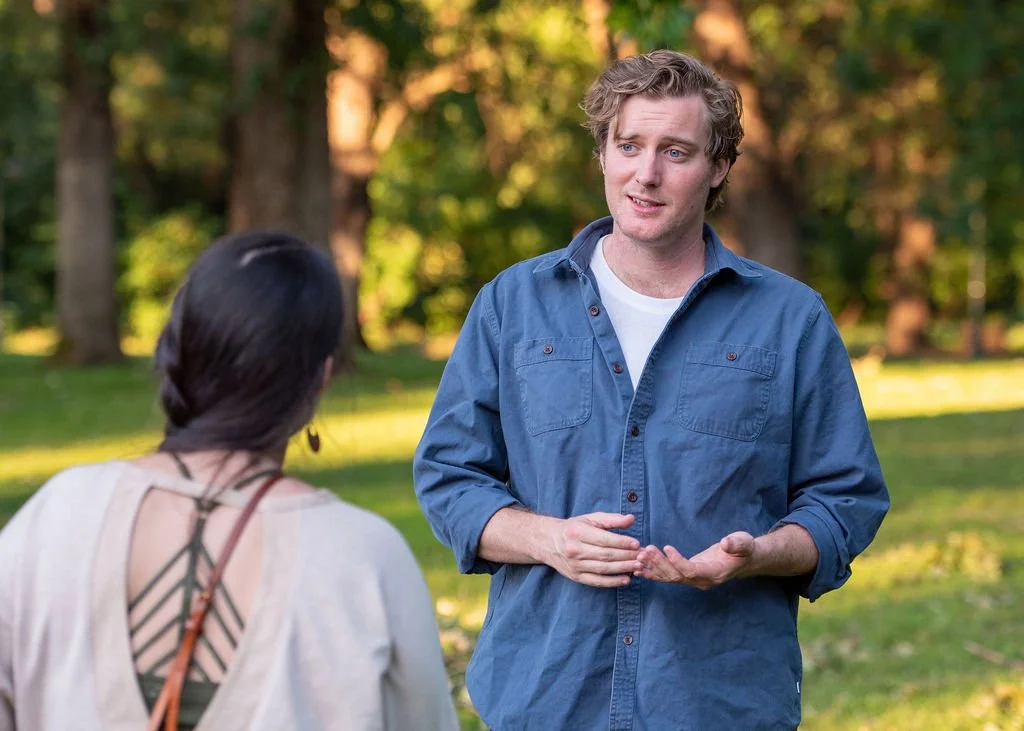 Addison Winslow speaks with a Chico resident outdoors in Chico.