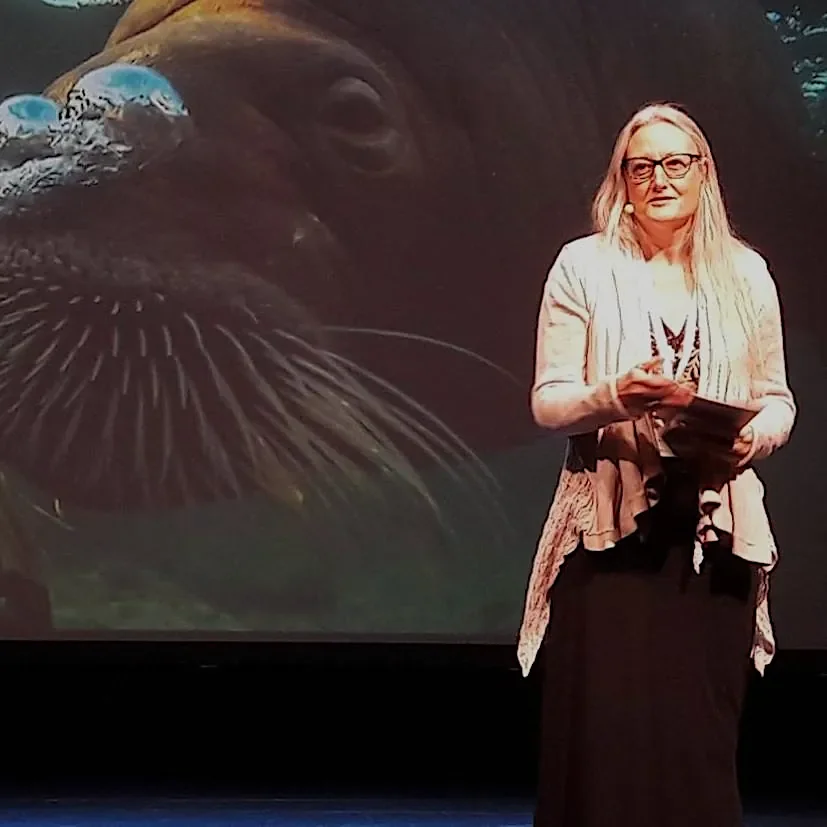 Jamie K. Reaser reciting poetry at the Arctic Biodiversity Congress in Rovaniemi, Finland