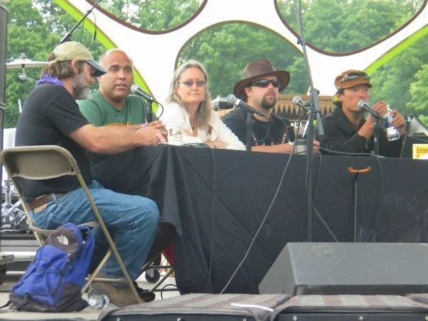 Paul Stamets, Michael Gelobter, Jamie K. Reaser, Jonathan Gelbard, and Michael Kang speaking on a Rothbury Music Festival panel in 2009