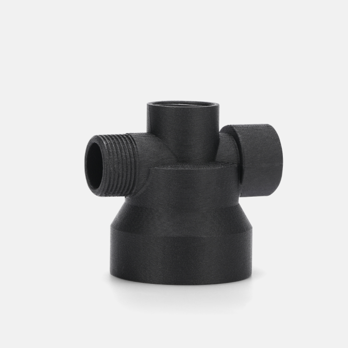 Black plastic pipe fitting with multiple threaded openings on a plain white background