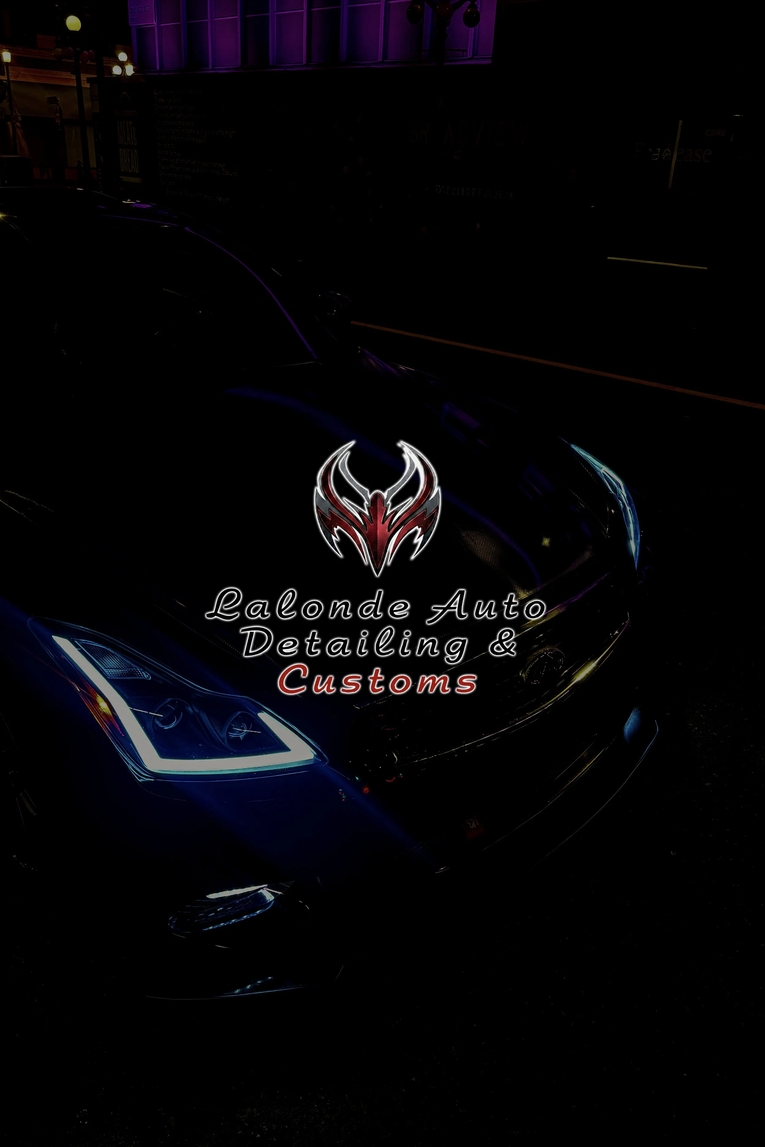 Night view of a black luxury car with illuminated headlights, overlaid with a logo of a red and black stylized dragon or phoenix with the text "Lalonde Auto Detailing & Customs".