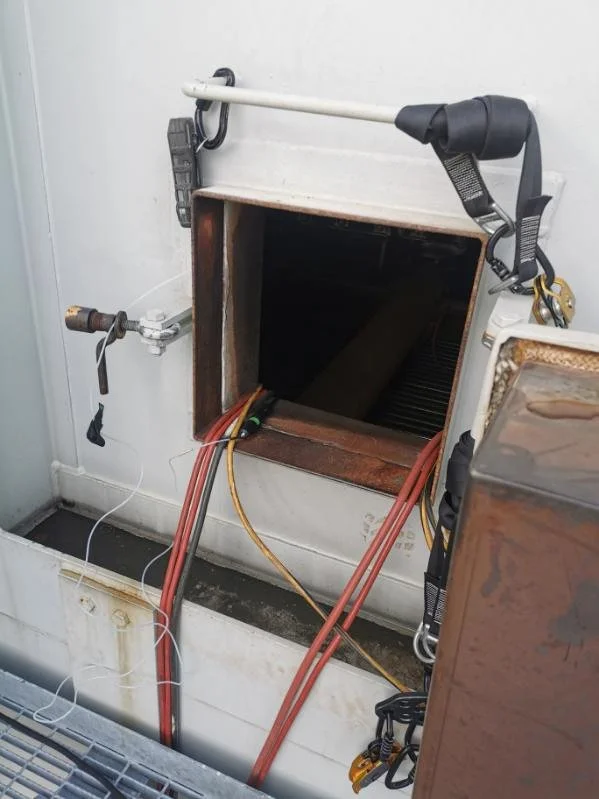 CONFINED SPACE ACCESS POINT ON SCAFFOLDING FOR ENTRY INTO THE CONFINED SPACE