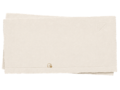 White envelope with a small gold design in the bottom left corner and top right corner.