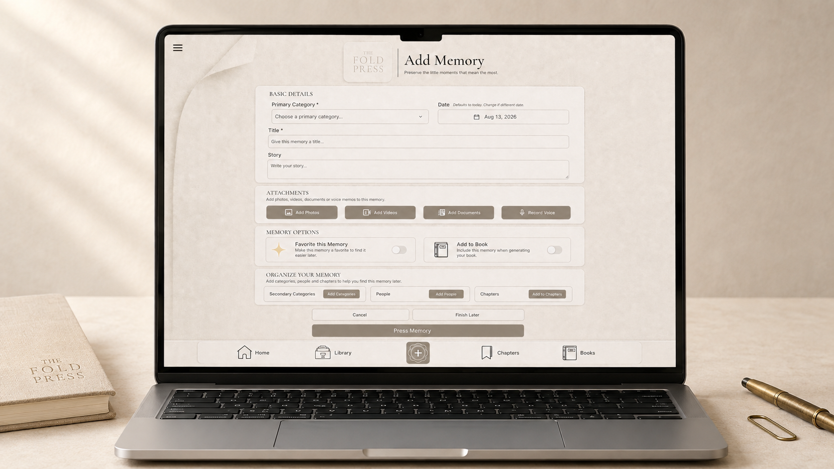 Laptop screen displaying a digital interface for adding a memory or note, with options for categorization, attaching photos or videos, and organizing memories, on a beige desk with a journal and gold pen nearby.