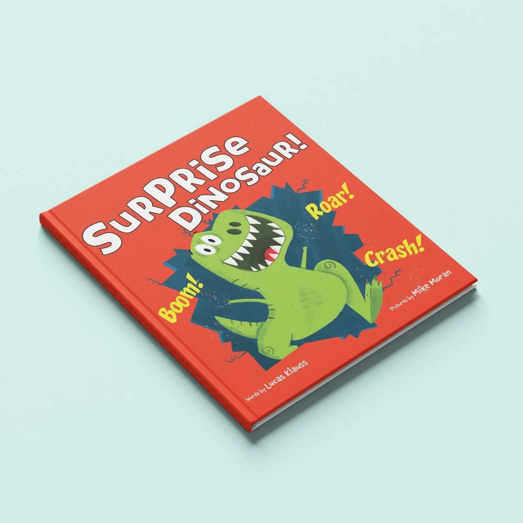 Cover of a children's book titled "Superprise Dinosaur!" featuring a green cartoon dinosaur with sharp teeth on a red background, with words like "Boom!", "Roar!", and "Crash!" displayed around the dinosaur.