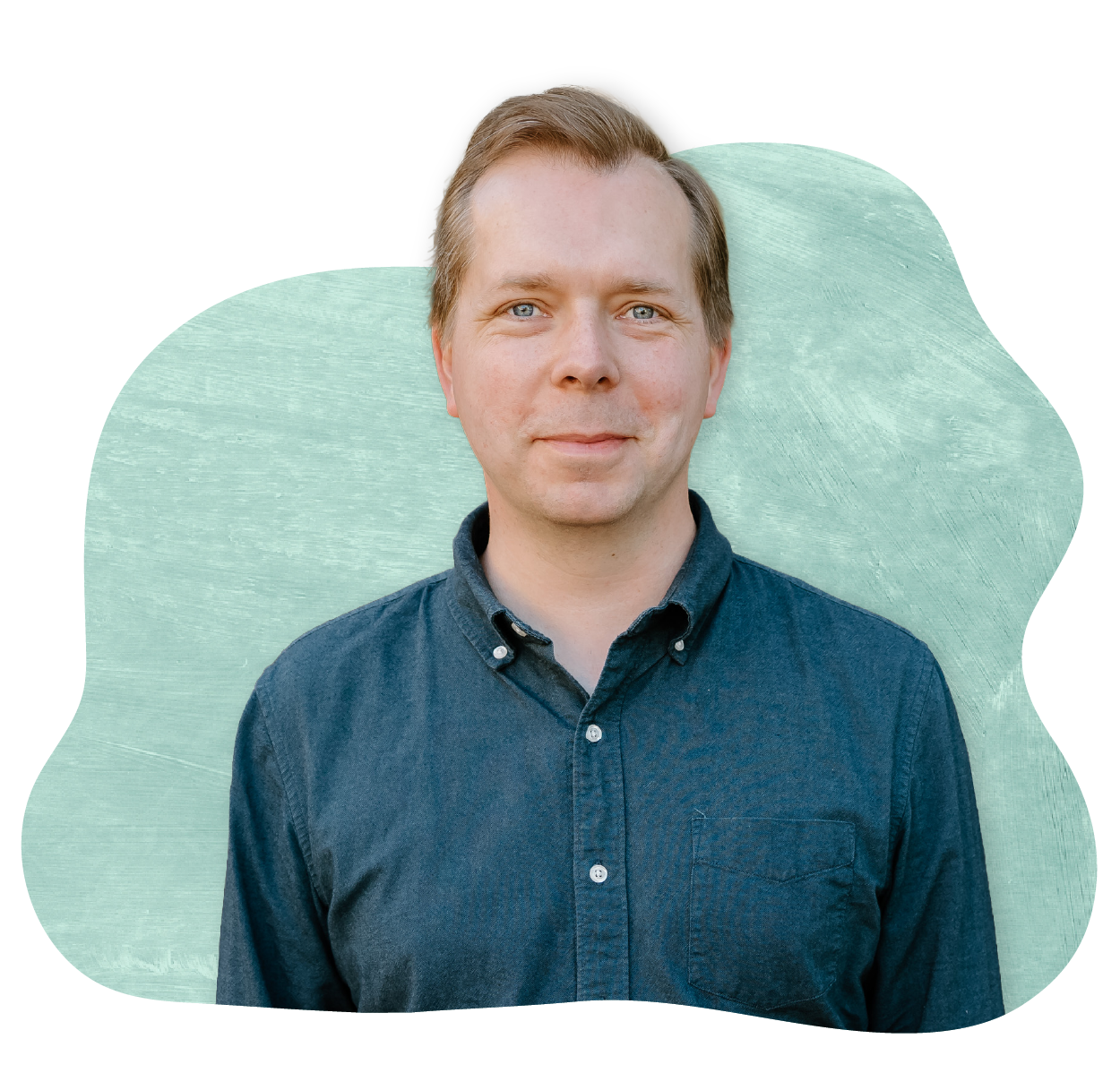 Author, Lucas Klauss, wearing a dark blue button-up shirt.