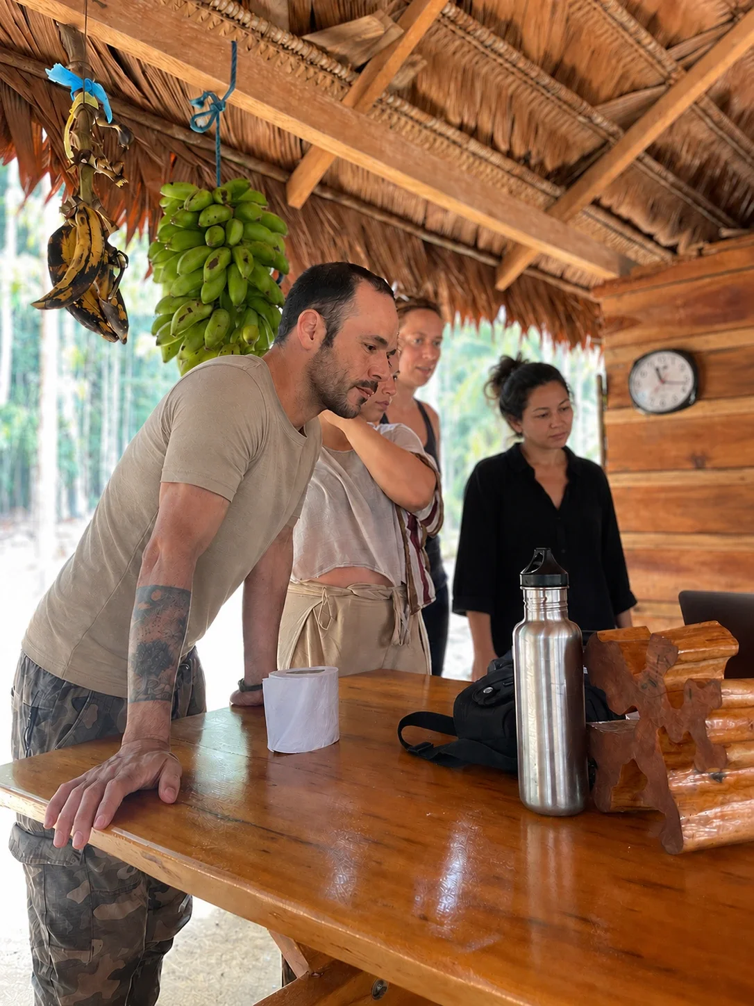 Travellers sharing experiences and reflections during a regenerative tourism journey in the Brazilian Amazon.