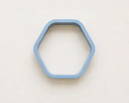 A light blue rounded hexagonal cookie cutter on a plain white background.