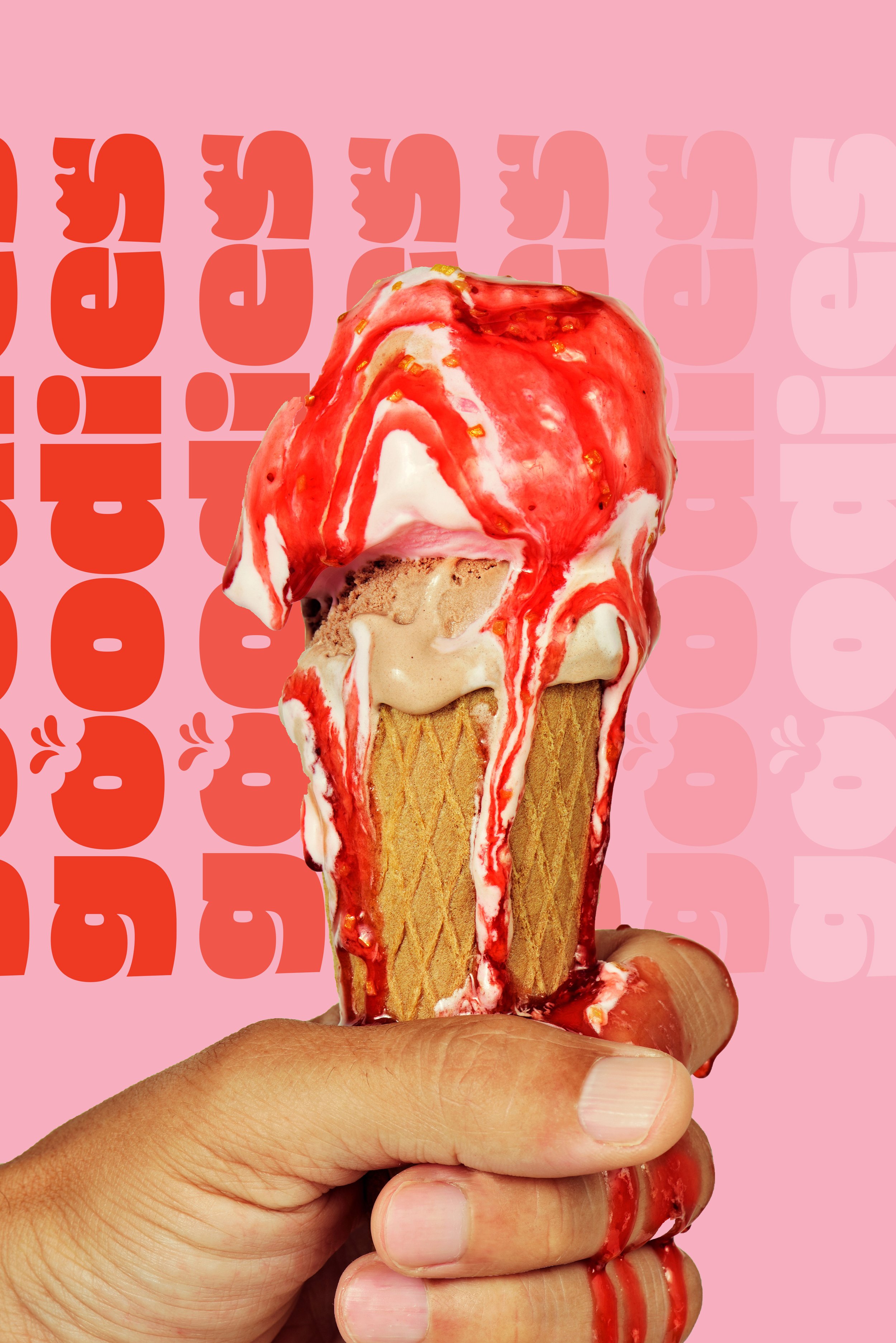 Close-up of a hand holding an ice cream cone with vanilla and strawberry swirl ice cream, drizzled with strawberry syrup, against a pink background with red and light pink text.