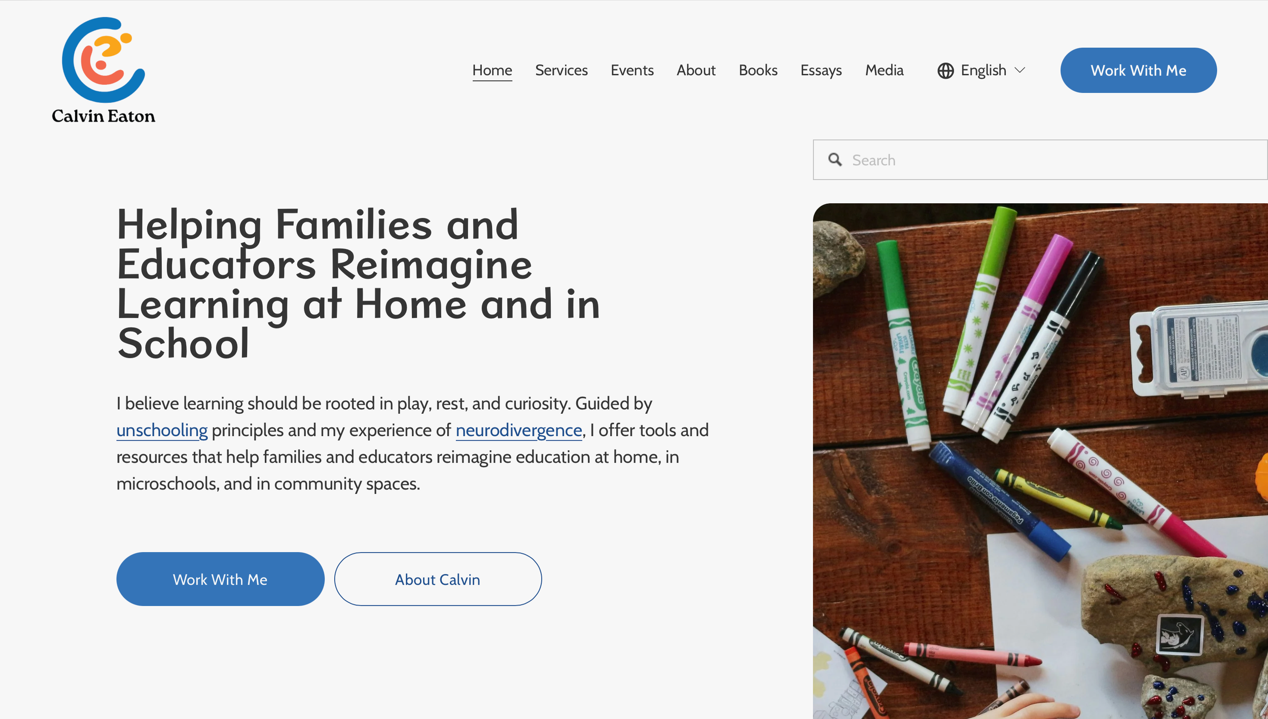 Website homepage for Calvin Eaton, featuring a colorful logo in the top left corner, navigation menu, and an image of miscellaneous art supplies including markers, a plastic container, and decorated rocks on a wooden surface.