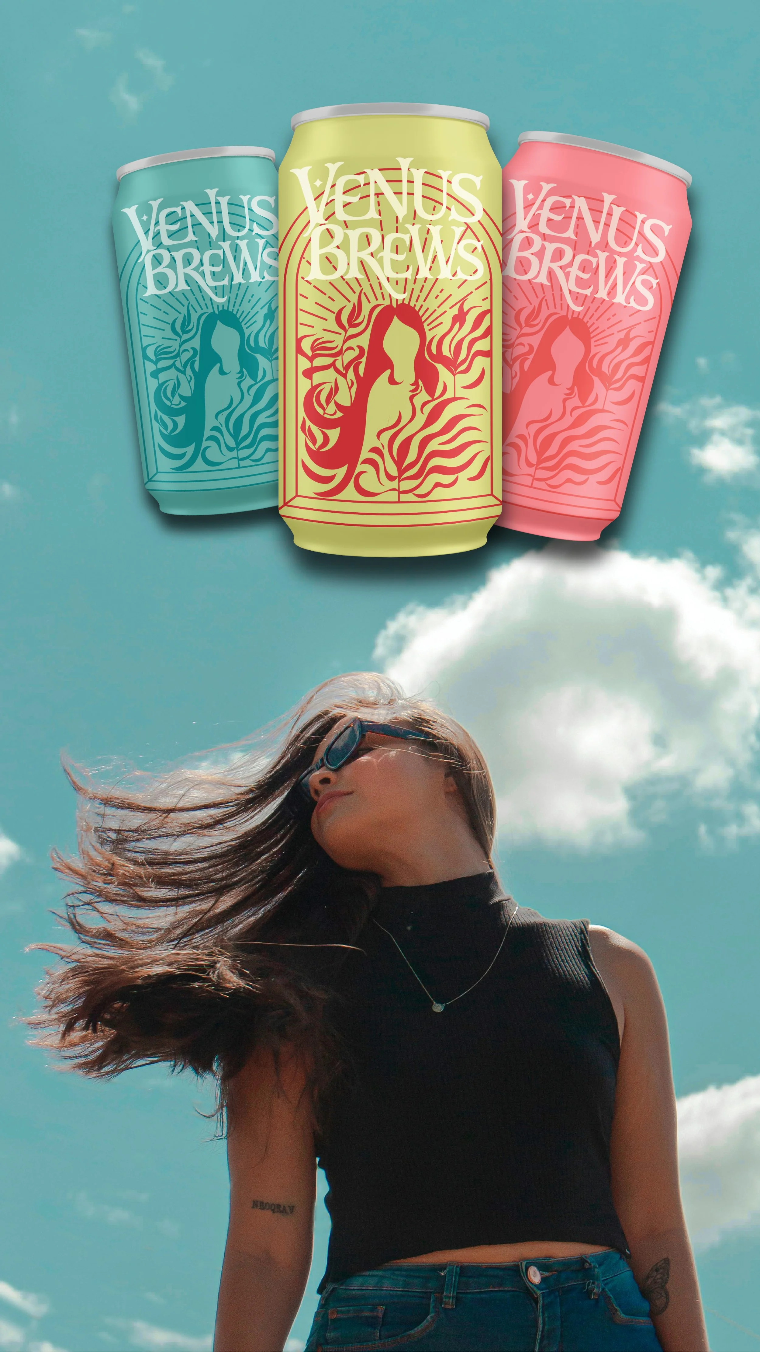 A woman with long hair, wearing sunglasses, a black sleeveless top, and jeans, standing outdoors against a blue sky with scattered white clouds, with her hair blowing in the wind. Above her are three cans of Venus Brews with colorful designs floating in the sky.