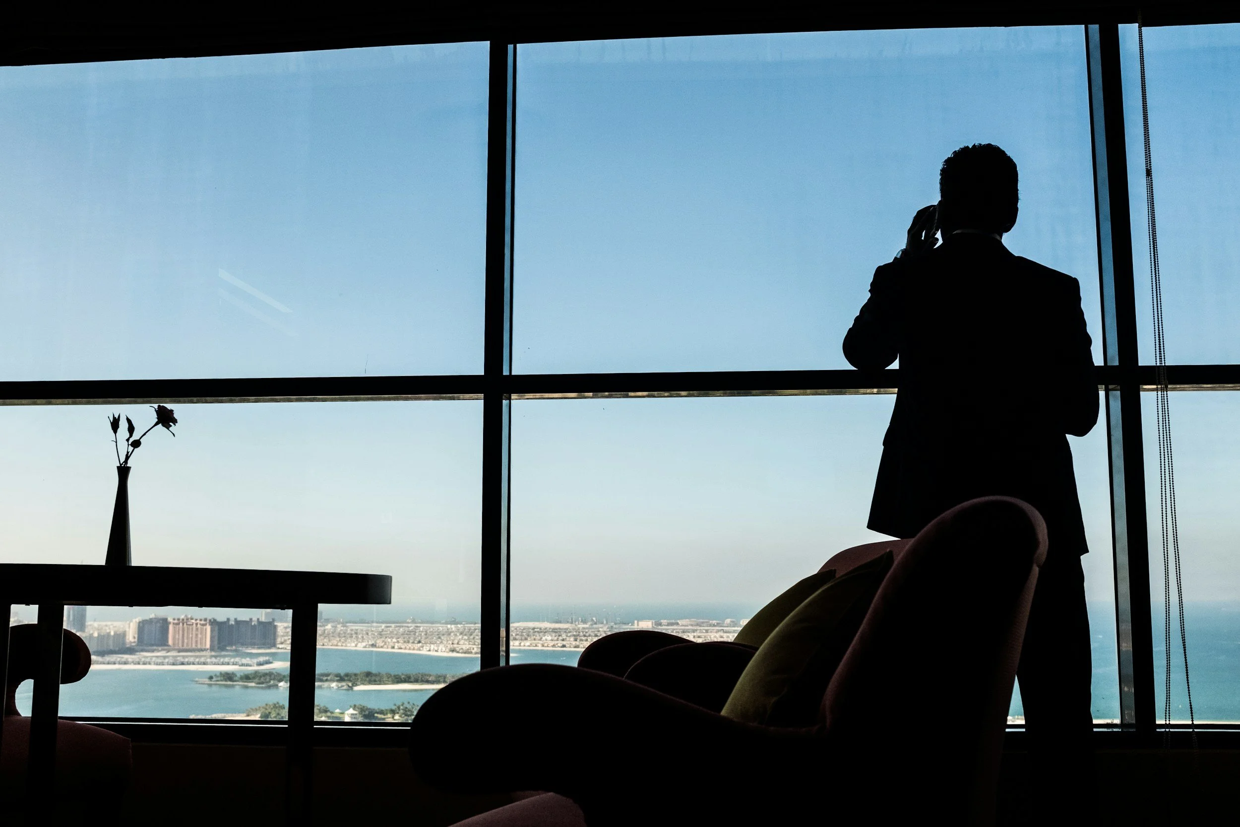Hotel executive looking out window