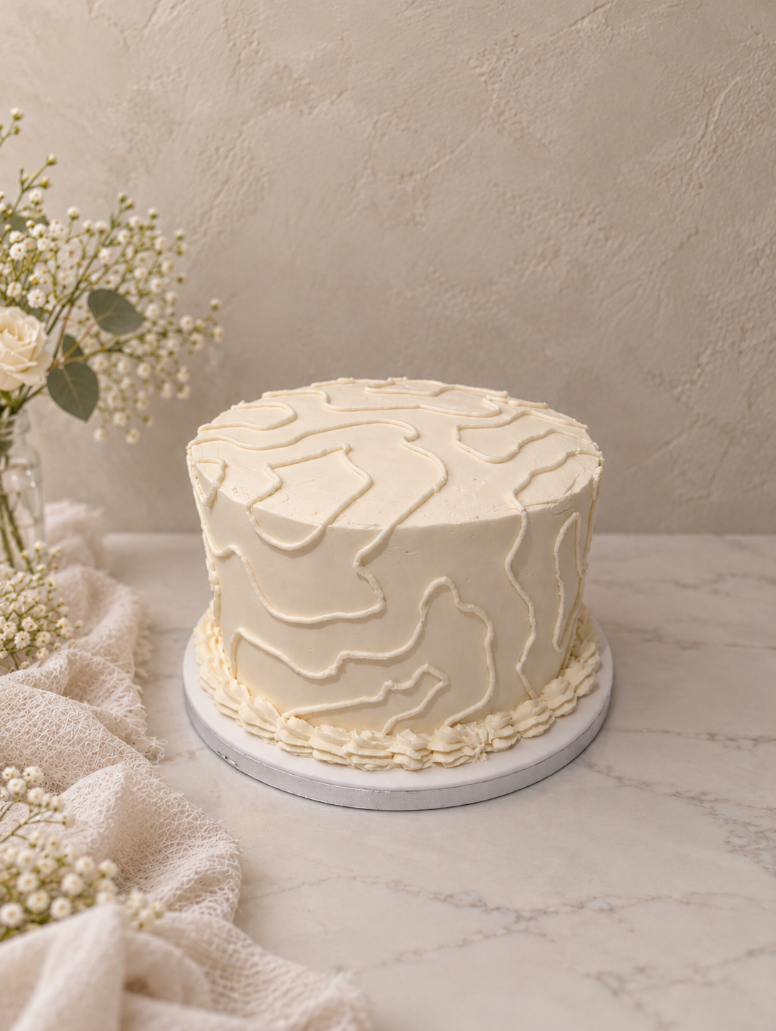 'Squiggle' piped ivory wedding cake