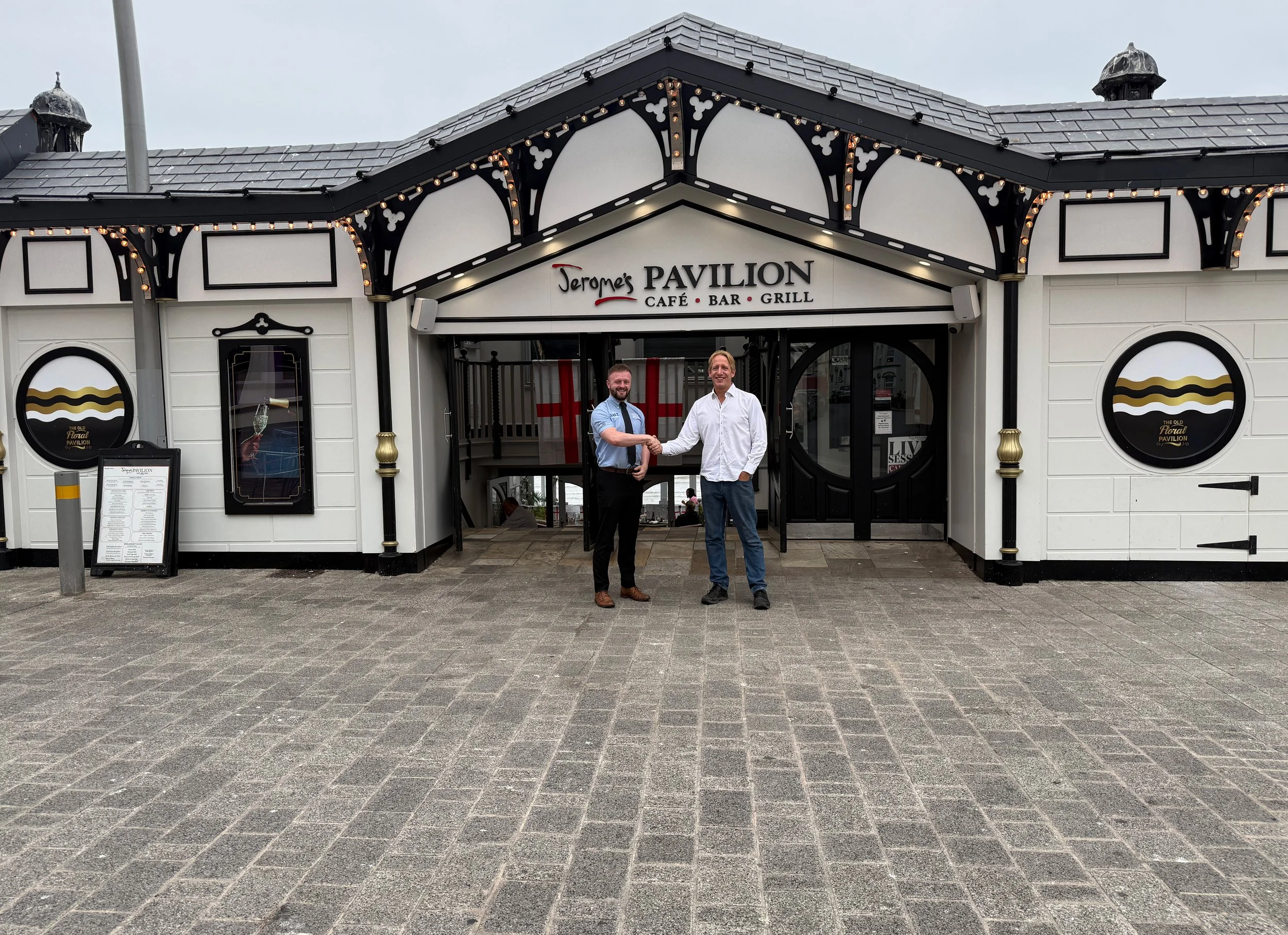 Jerome’s Pavilion  Two men shaking hands outside Jerome’s Pavilion Café, Bar & Grill in Bridlington.