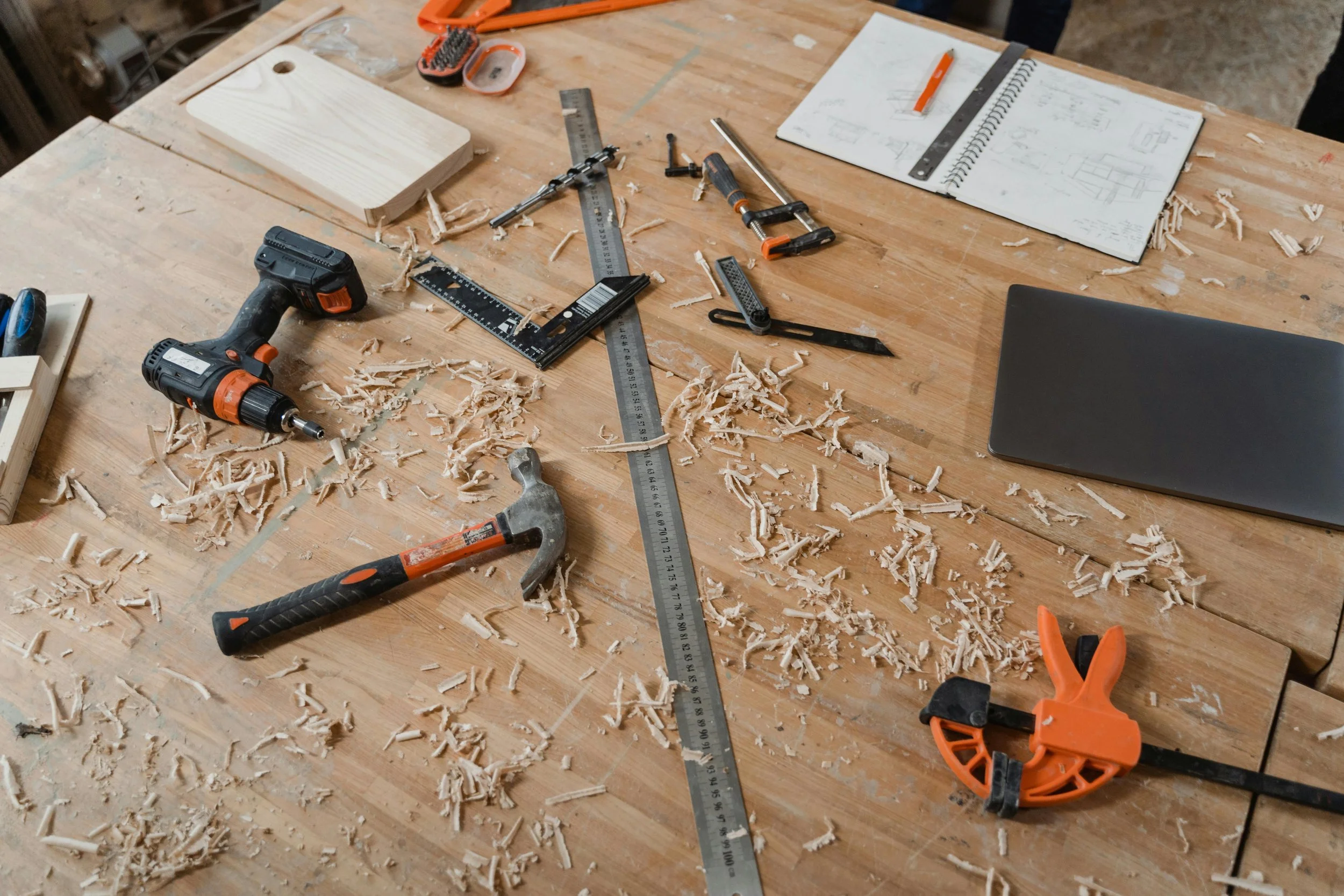 table full of carpentry and woodworking tools