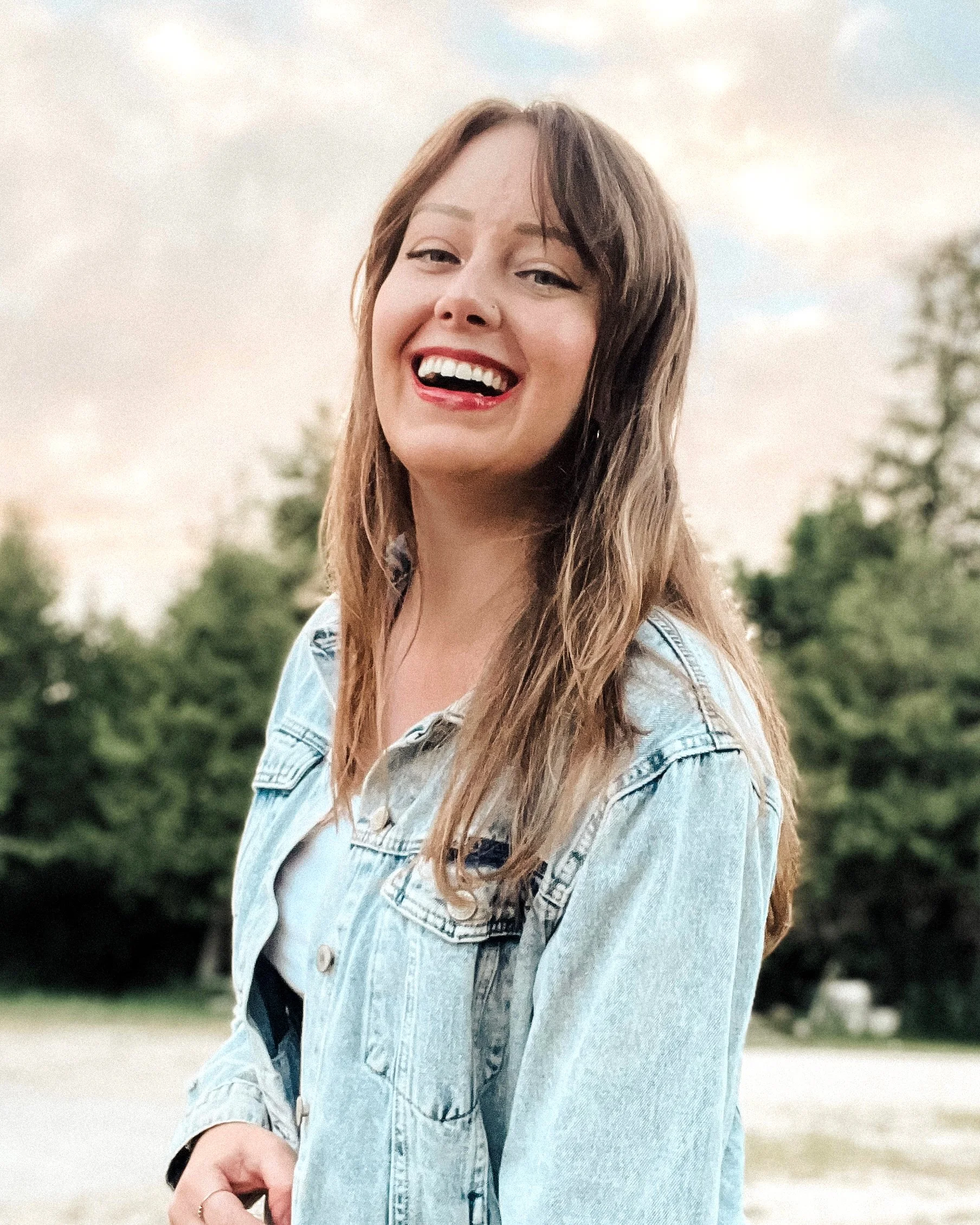 felicia joy standing in front of trees outside