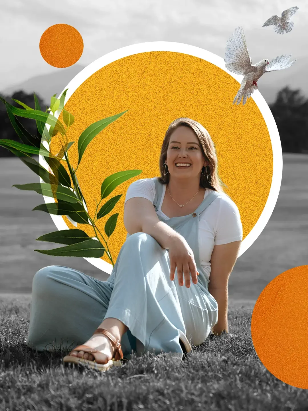 Felicia Joy sitting on grass and smiling