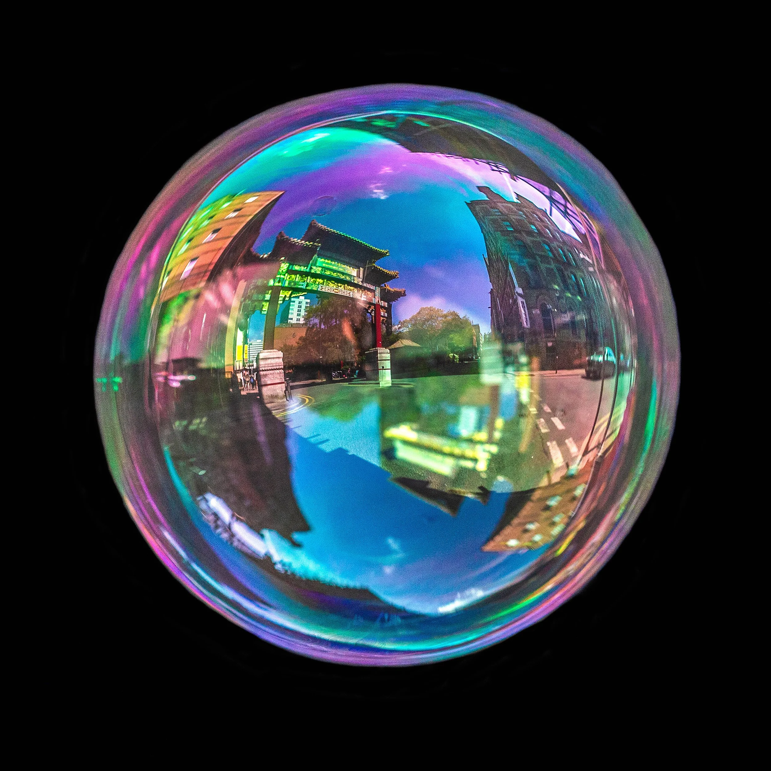 Real bubble photography artwork featuring reflections of china town arch archway in Manchester