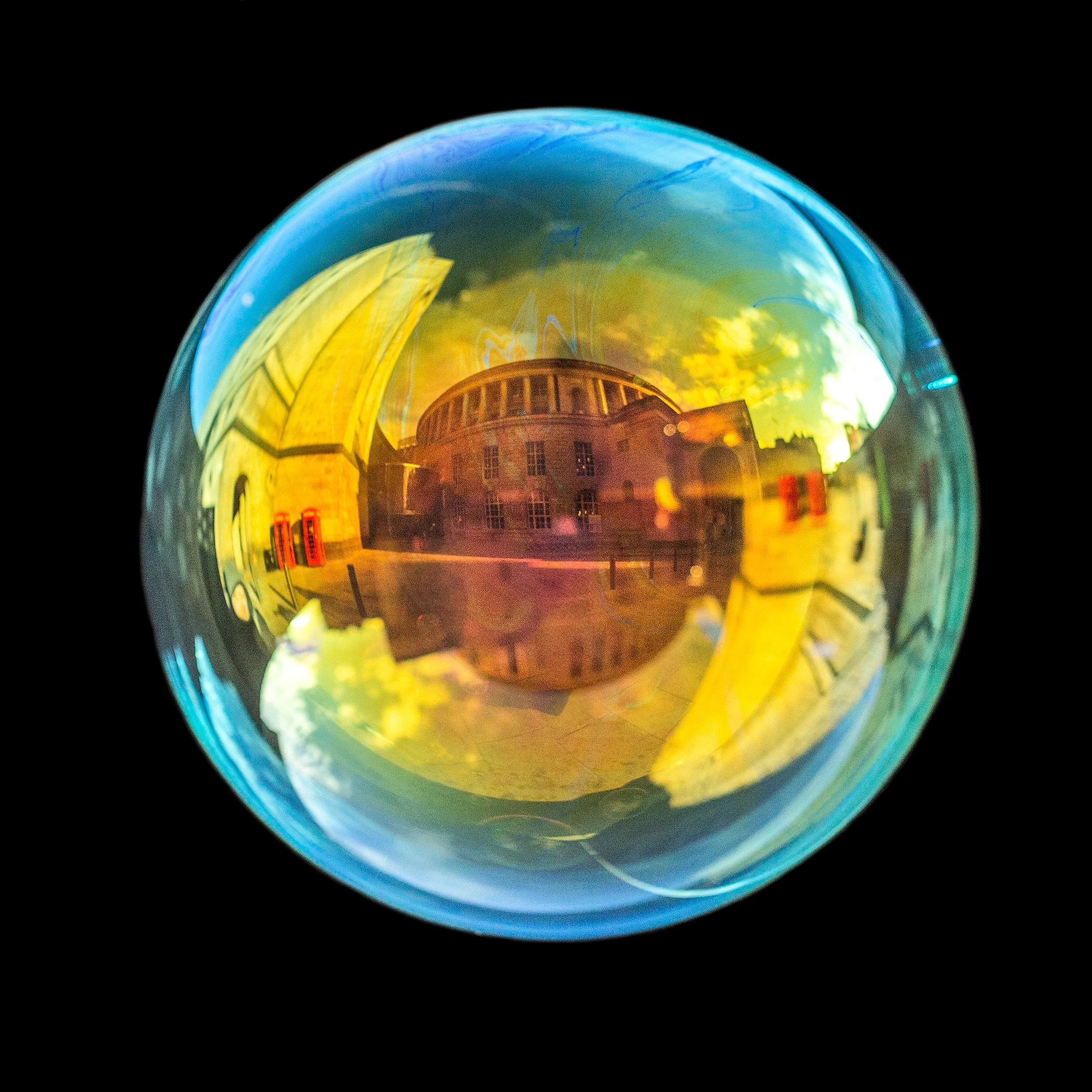 Fine art photograph of a real soap bubble reflecting Manchester central library in the city centre