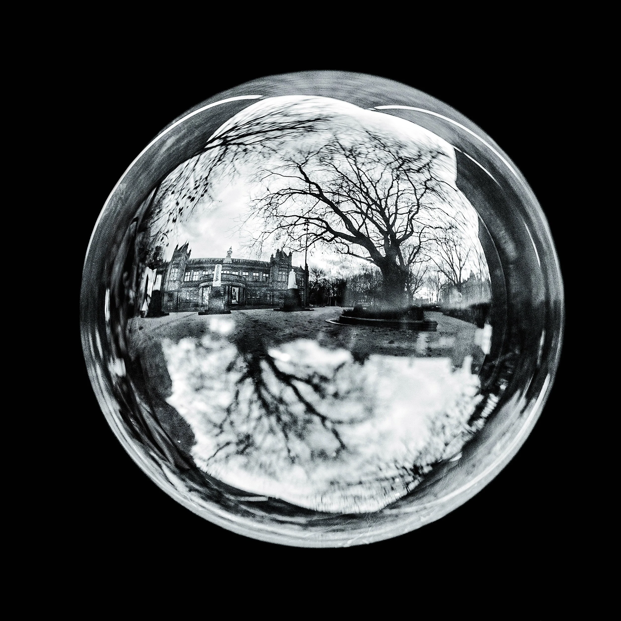 Fine art photograph of a real soap bubble reflecting whitworth art gallery in Manchester city centre