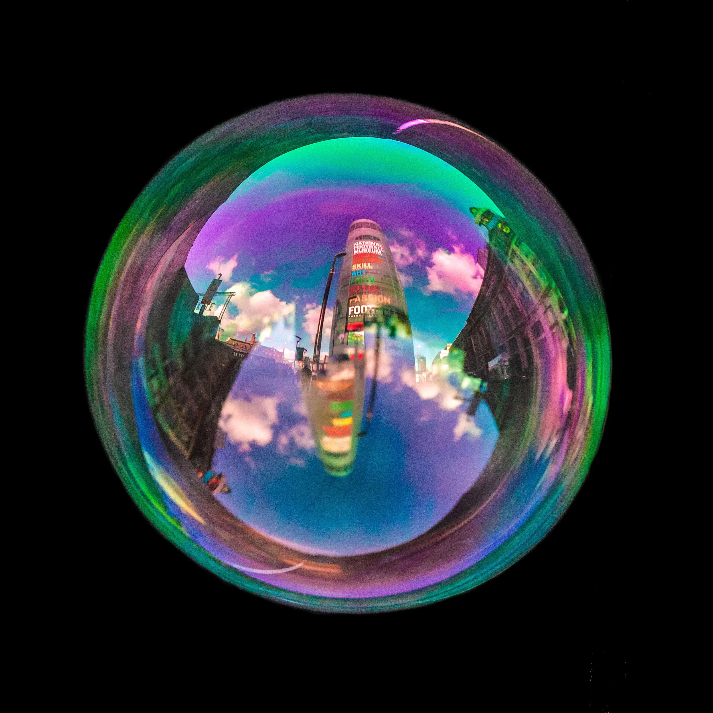 Fine art photograph of a real soap bubble reflecting urbis building in Manchester city centre
