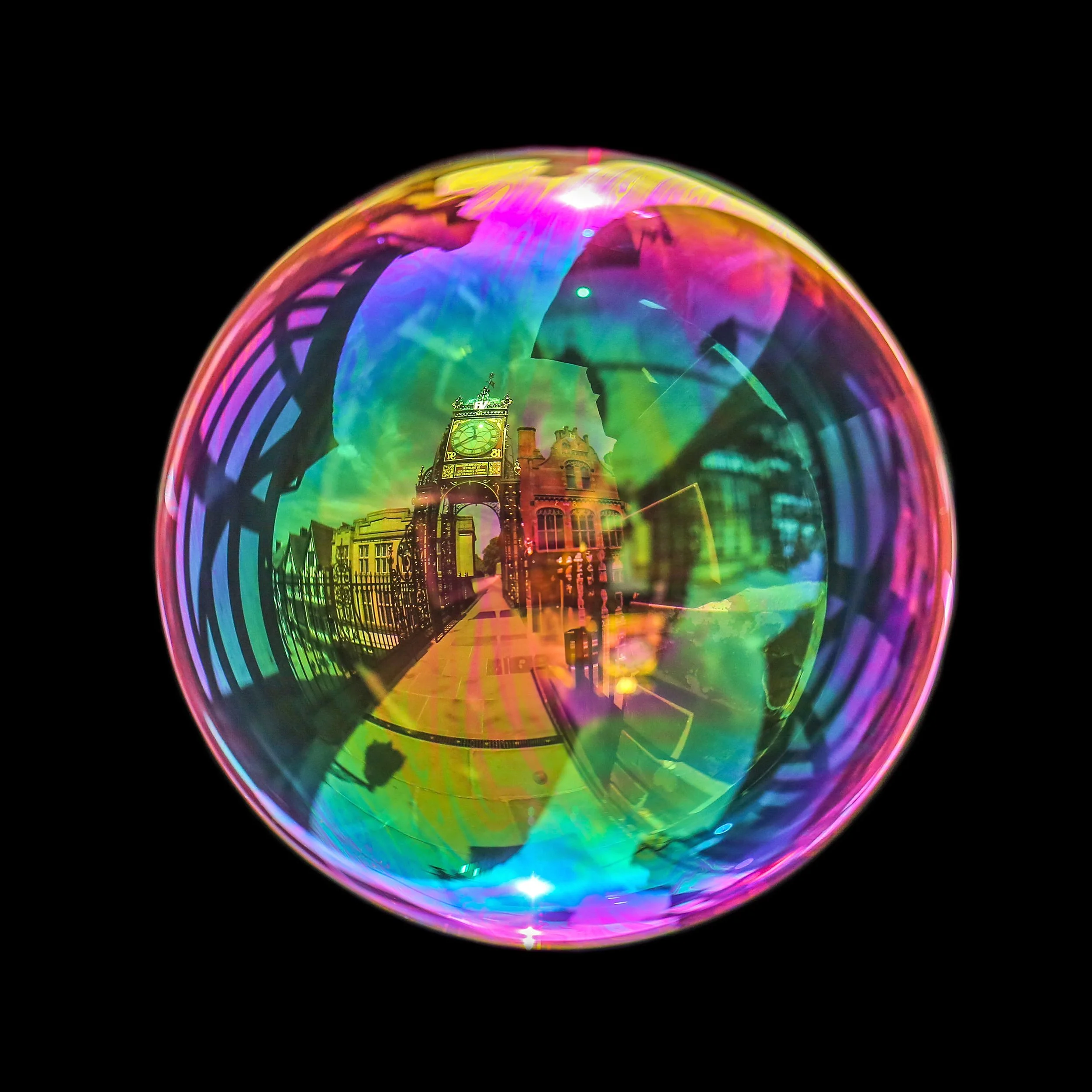 Fine art bubble photograph capturing Chester eastgate archway clock inside a real soap bubble