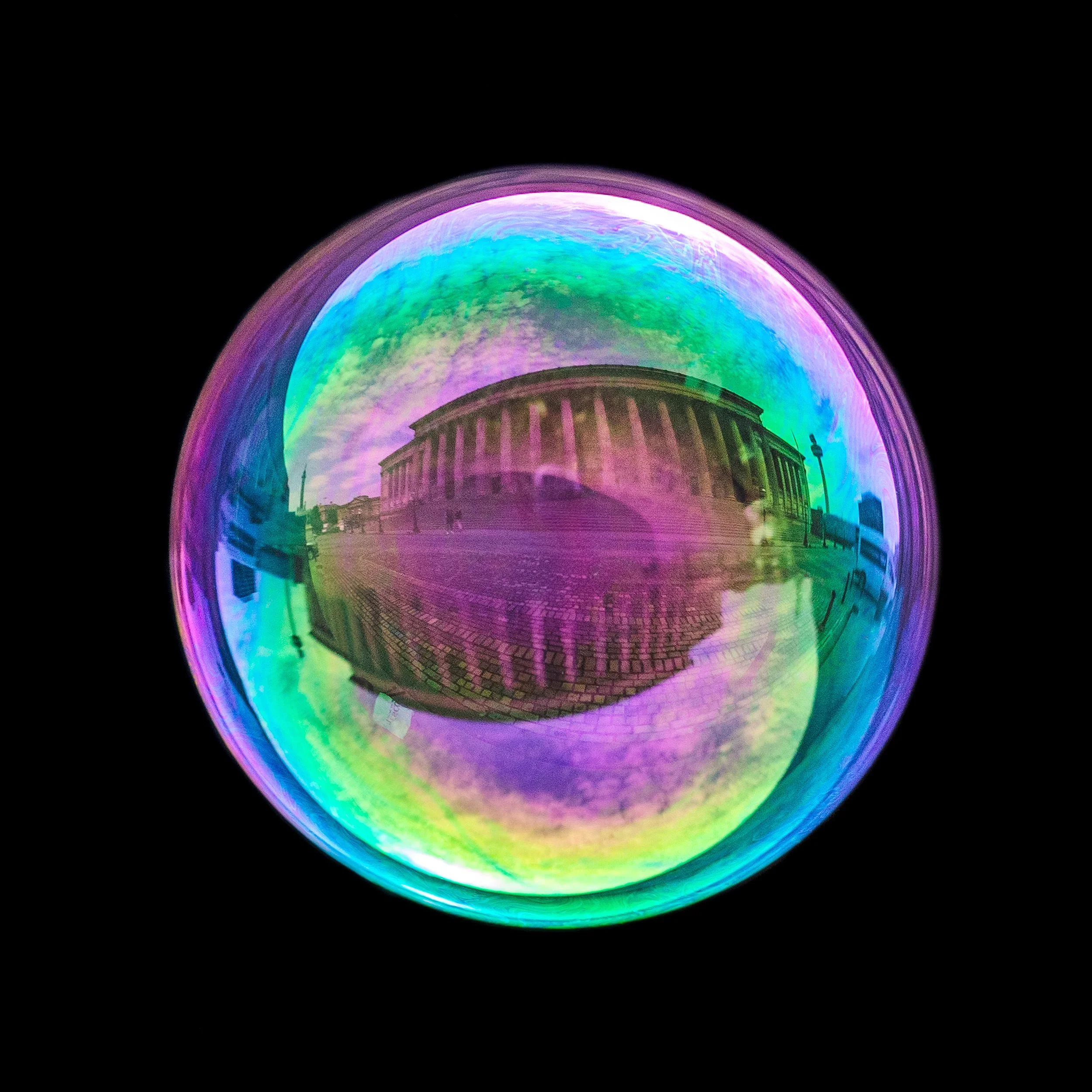 Fine art bubble photograph capturing st george's hall in liverpool inside a real soap bubble