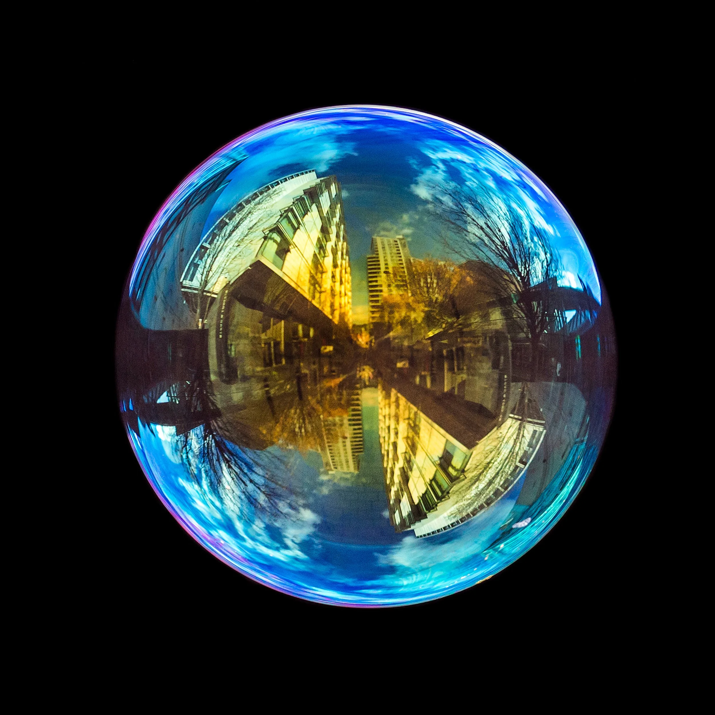 Fine art photograph of a real soap bubble reflecting windmill st in Manchester city centre