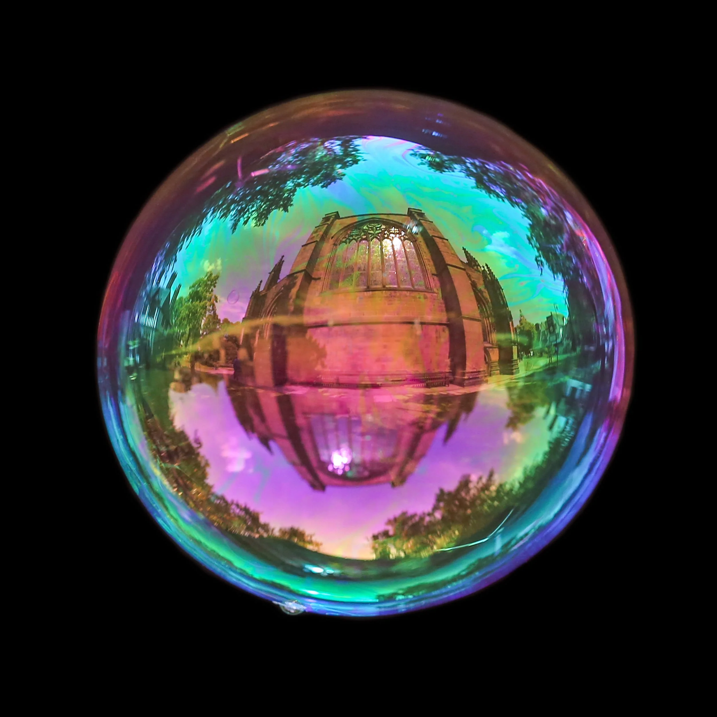 Fine art bubble photograph capturing Chester cathedral inside a real soap bubble