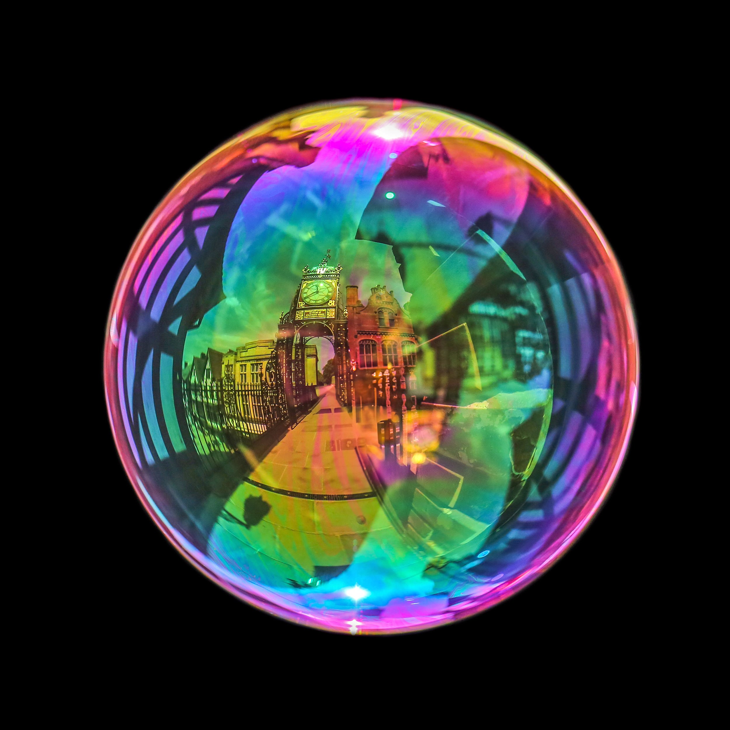 Fine art bubble photograph capturing Chester eastgate archway clock inside a real soap bubble
