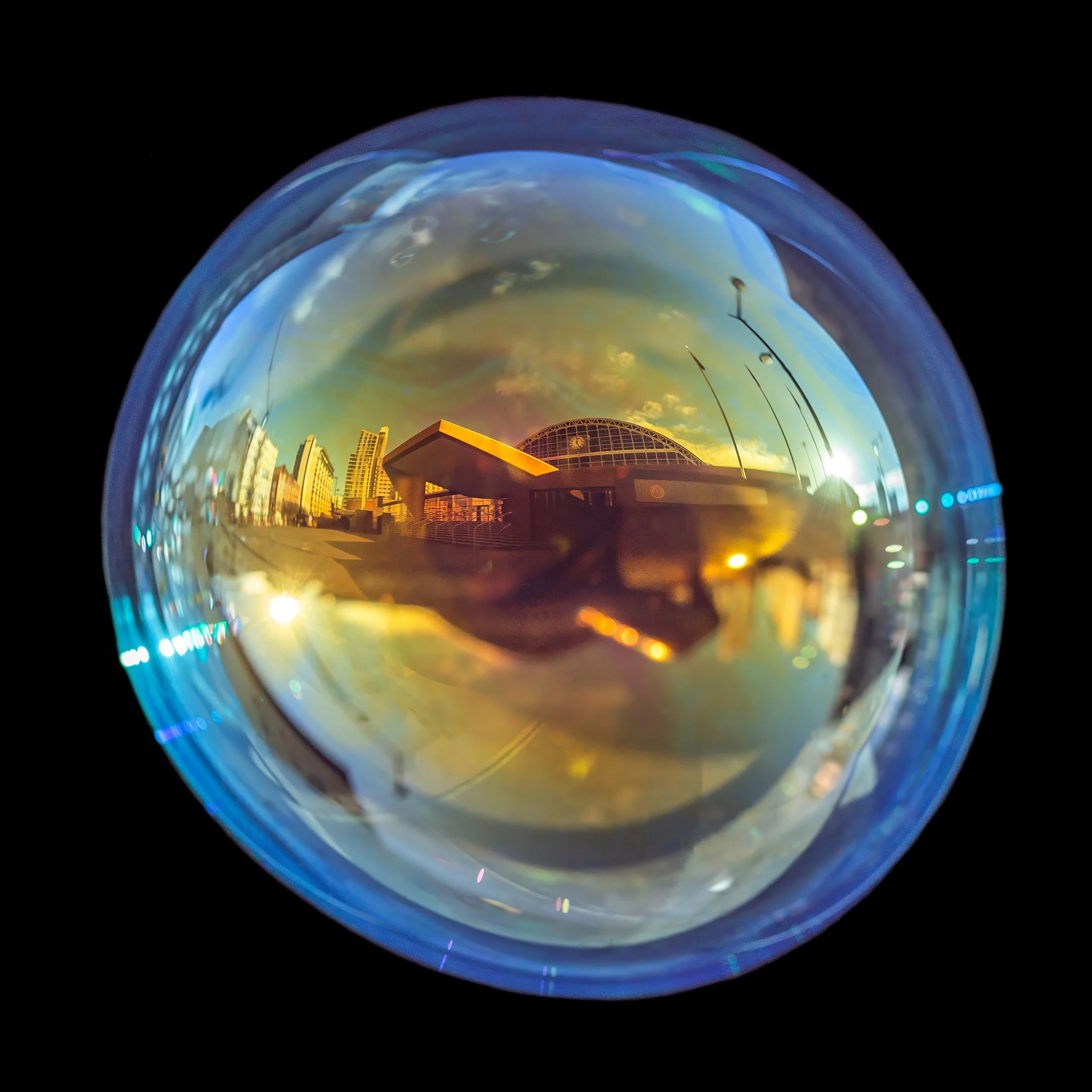 Fine art photograph of a real soap bubble reflecting Manchester central convention center gmex in the city centre