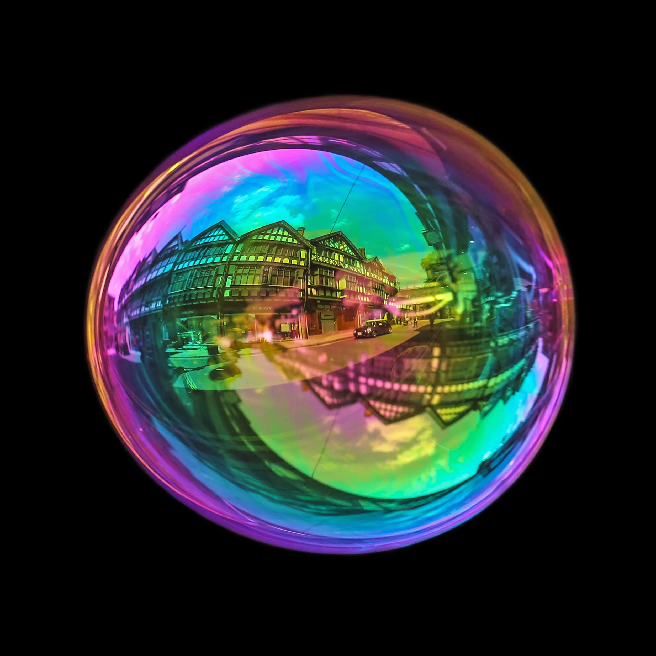 Fine art bubble photograph capturing St Werburgh St in Chester inside a real soap bubble