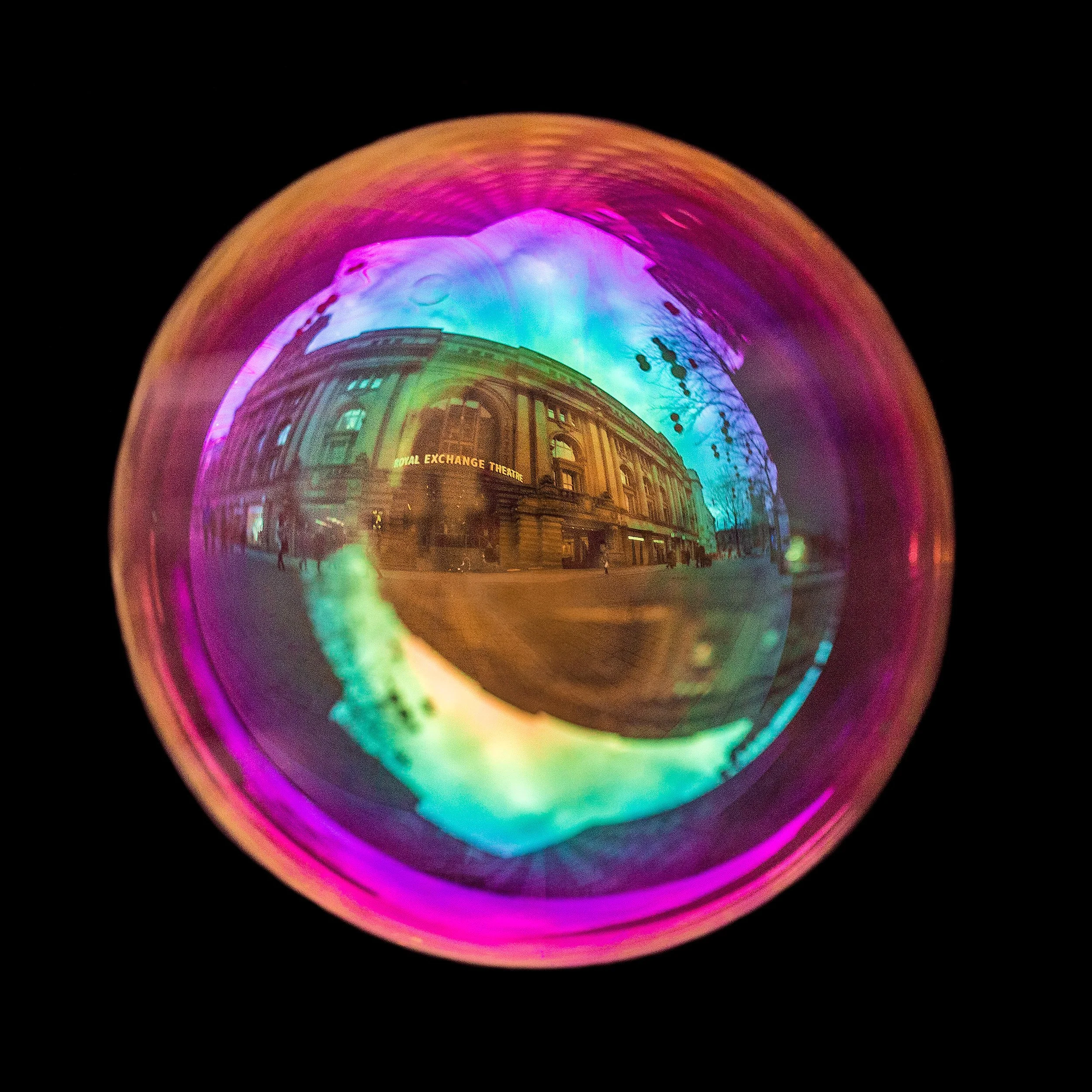 Fine art photograph of a real soap bubble reflecting royal exchange theatre in Manchester city centre