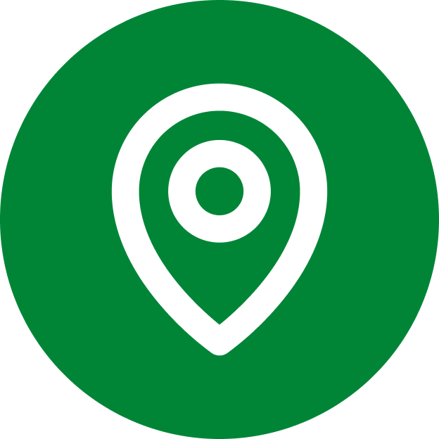 White location pin icon inside a solid green circle, symbolizing a map marker or geographical location.