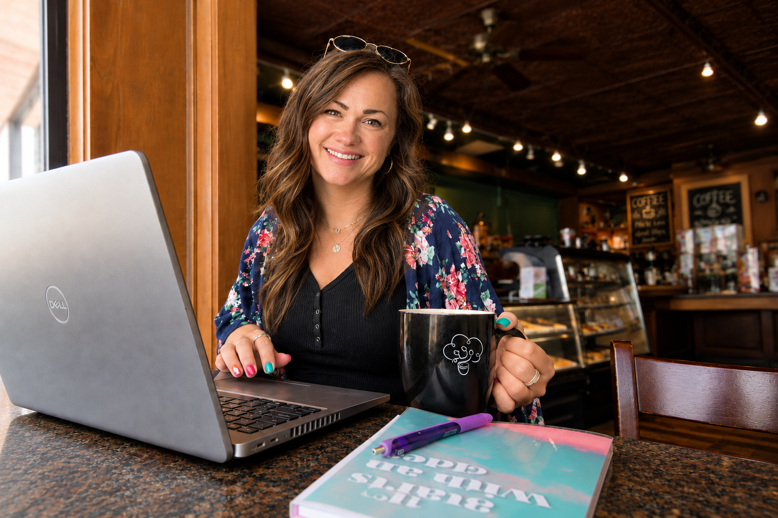 Shel writing at a local coffee shop, where she creates encouragement, stories, and resources for educators.