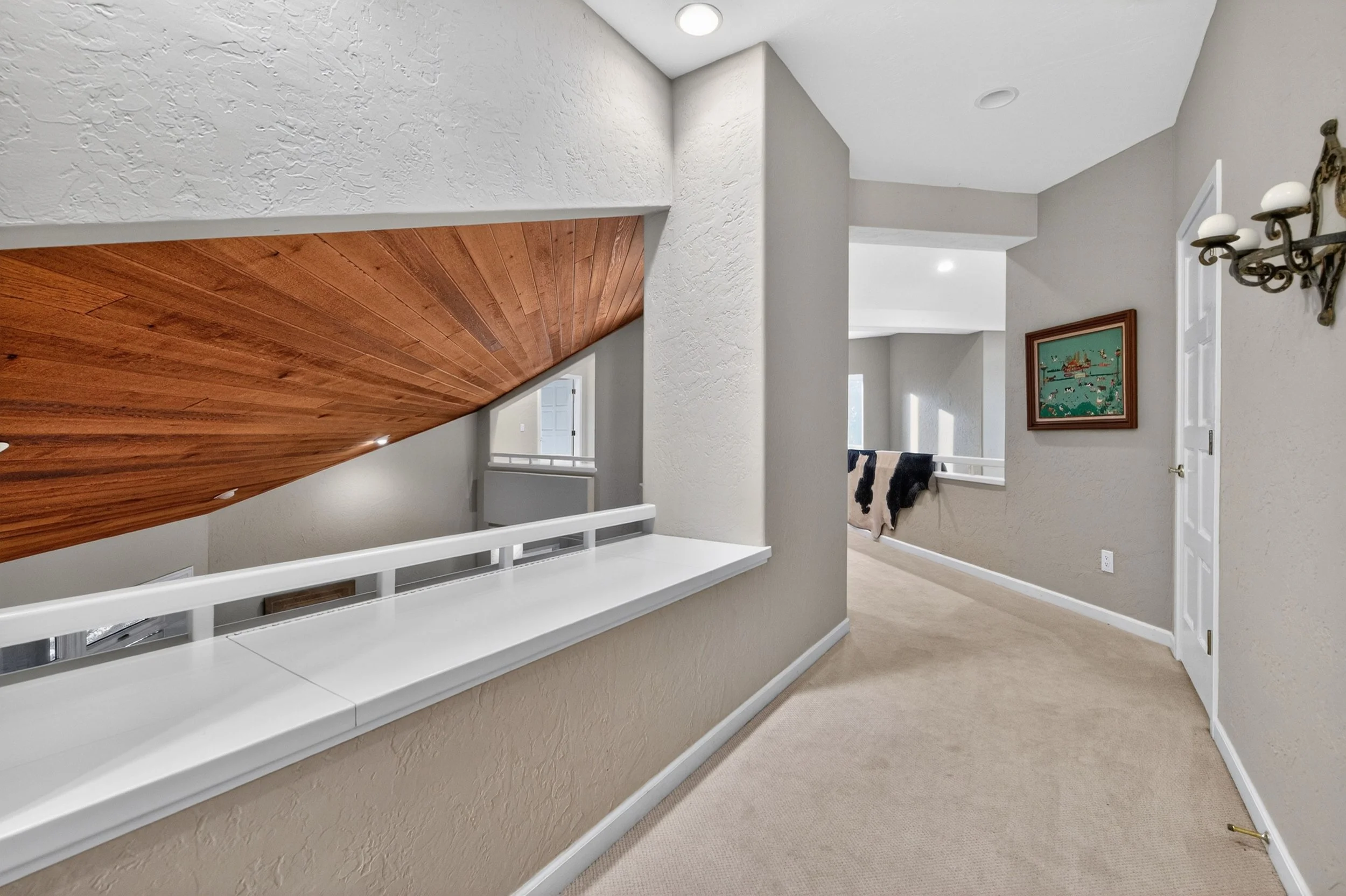 Interior hallway and upper-level landing at Airola Ranch in Vallecito California featuring natural light, custom architectural details, and elegant Sierra Foothill estate design.