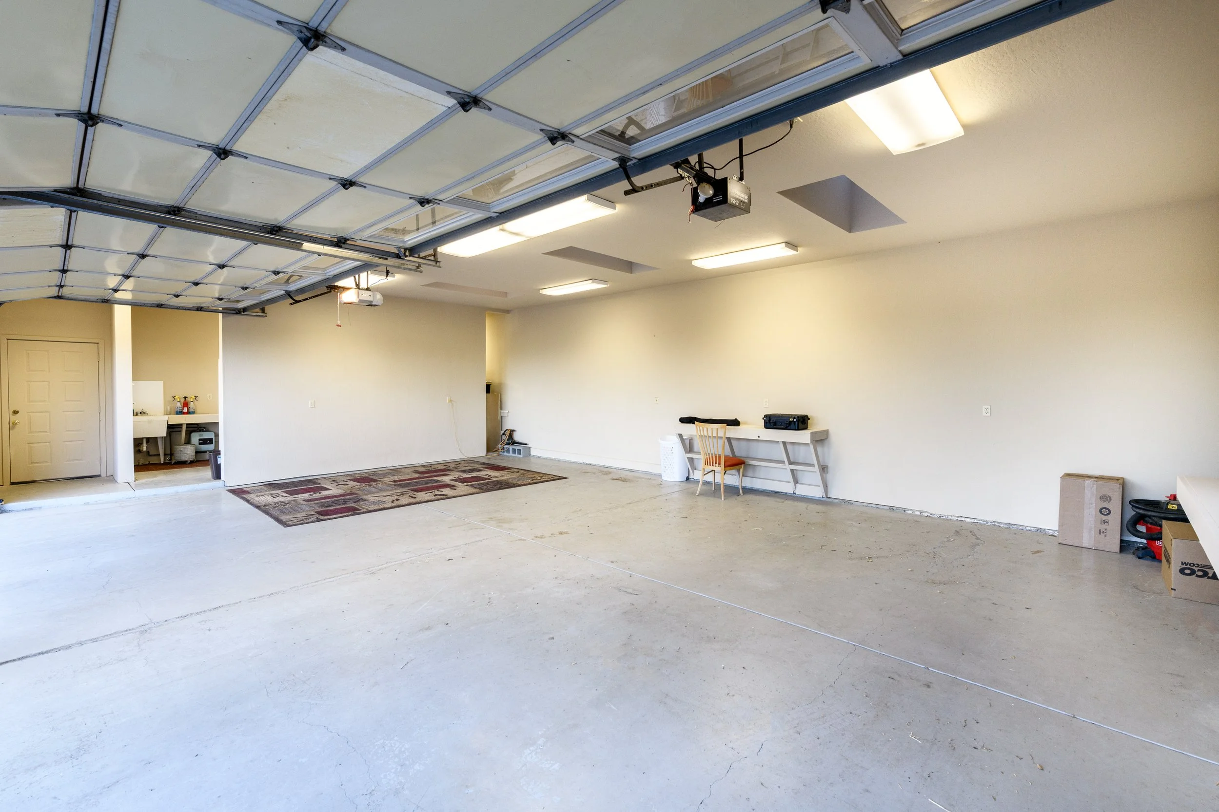 Oversized 3-car garage with workspace at Airola Road property