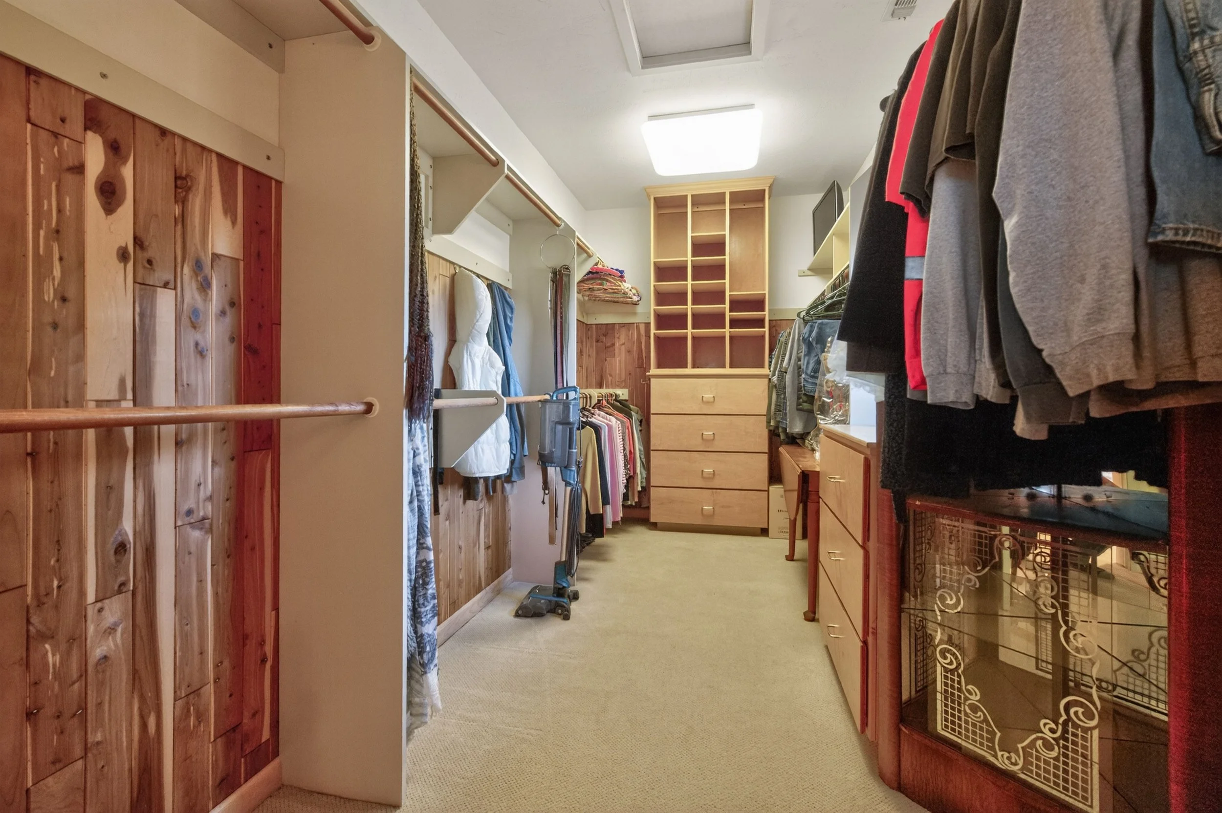 Spacious walk-in closet at Airola Ranch in Vallecito California featuring custom storage, built-in shelving, and luxury estate organization.