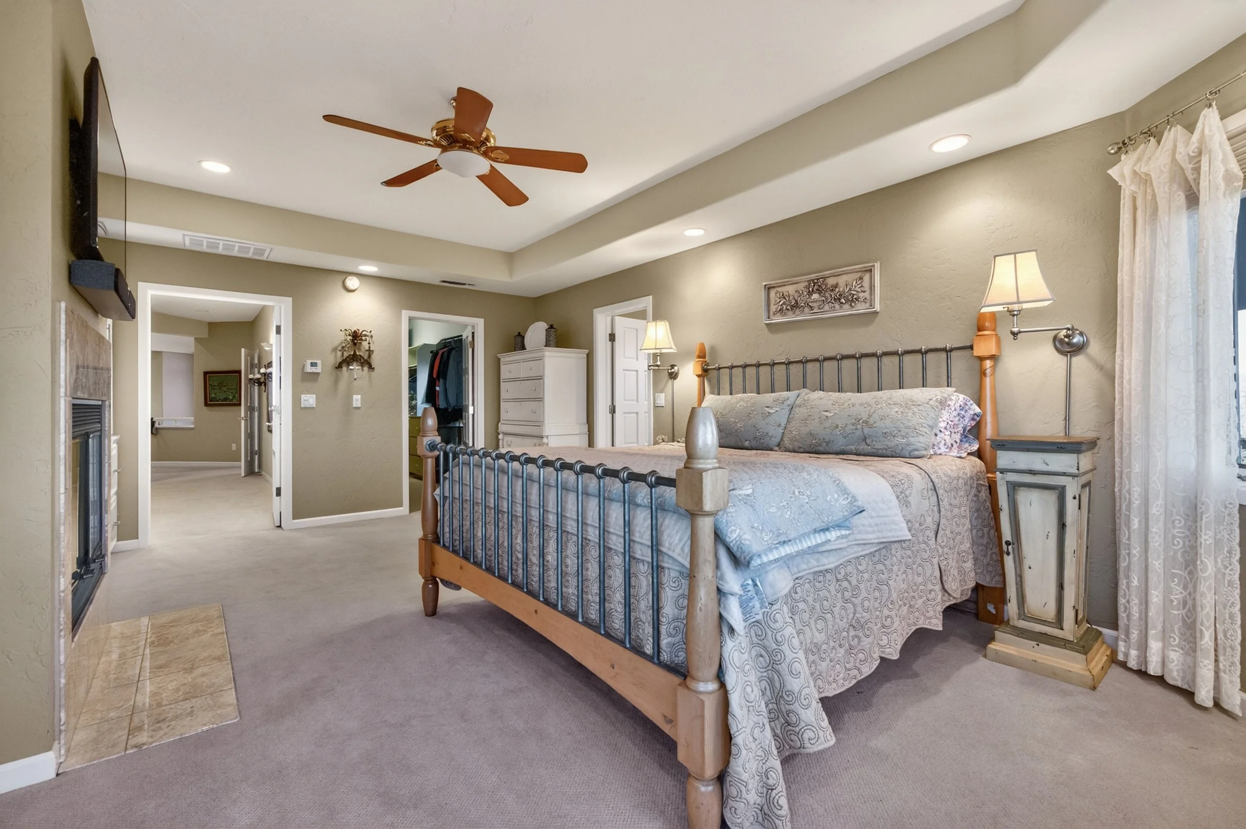 Primary suite at Airola Ranch in Vallecito California featuring warm luxury finishes, natural light, and refined Sierra Foothill estate comfort.