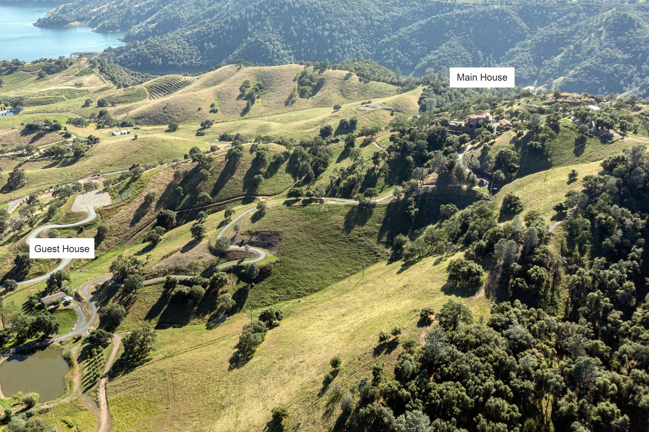 Aerial view of private foothill acreage overlooking New Melones Lake and surrounding Sierra Nevada landscapes