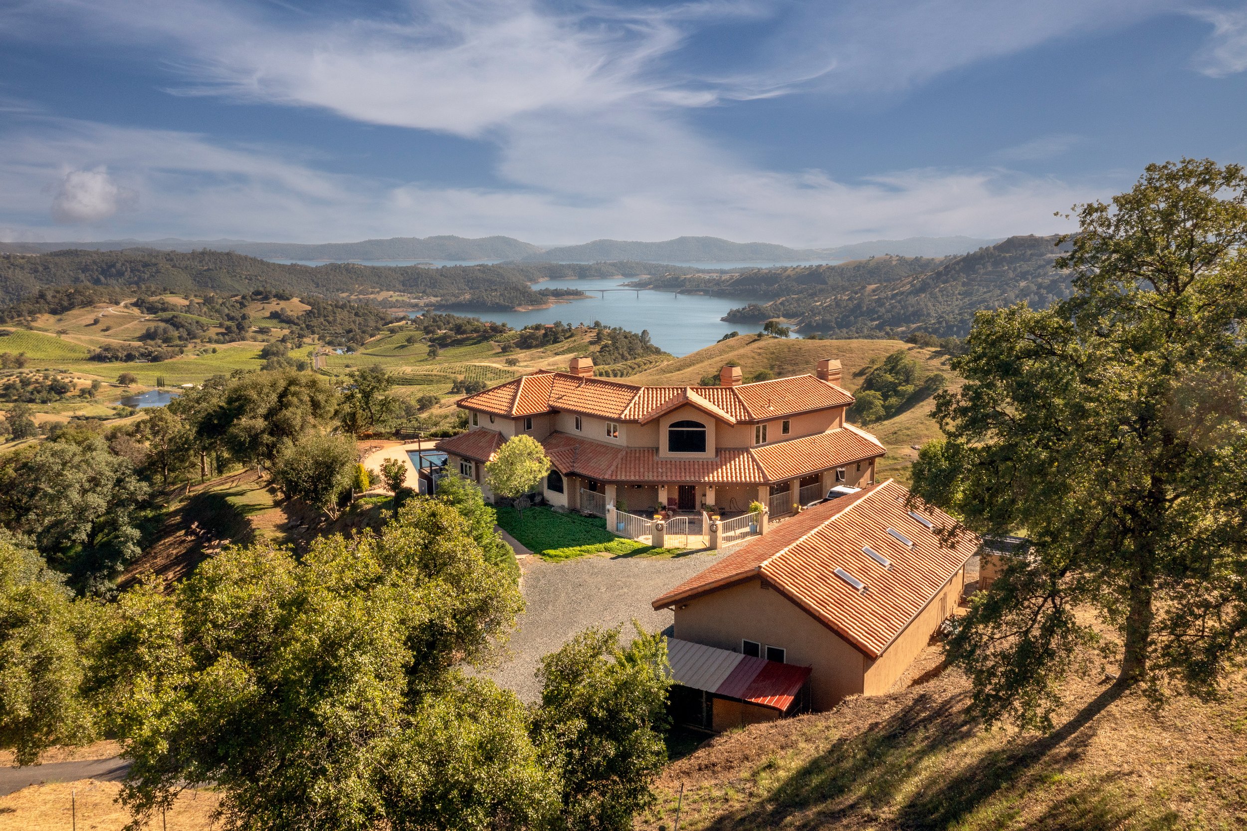 Drone view of home overlooking New Melones Lake