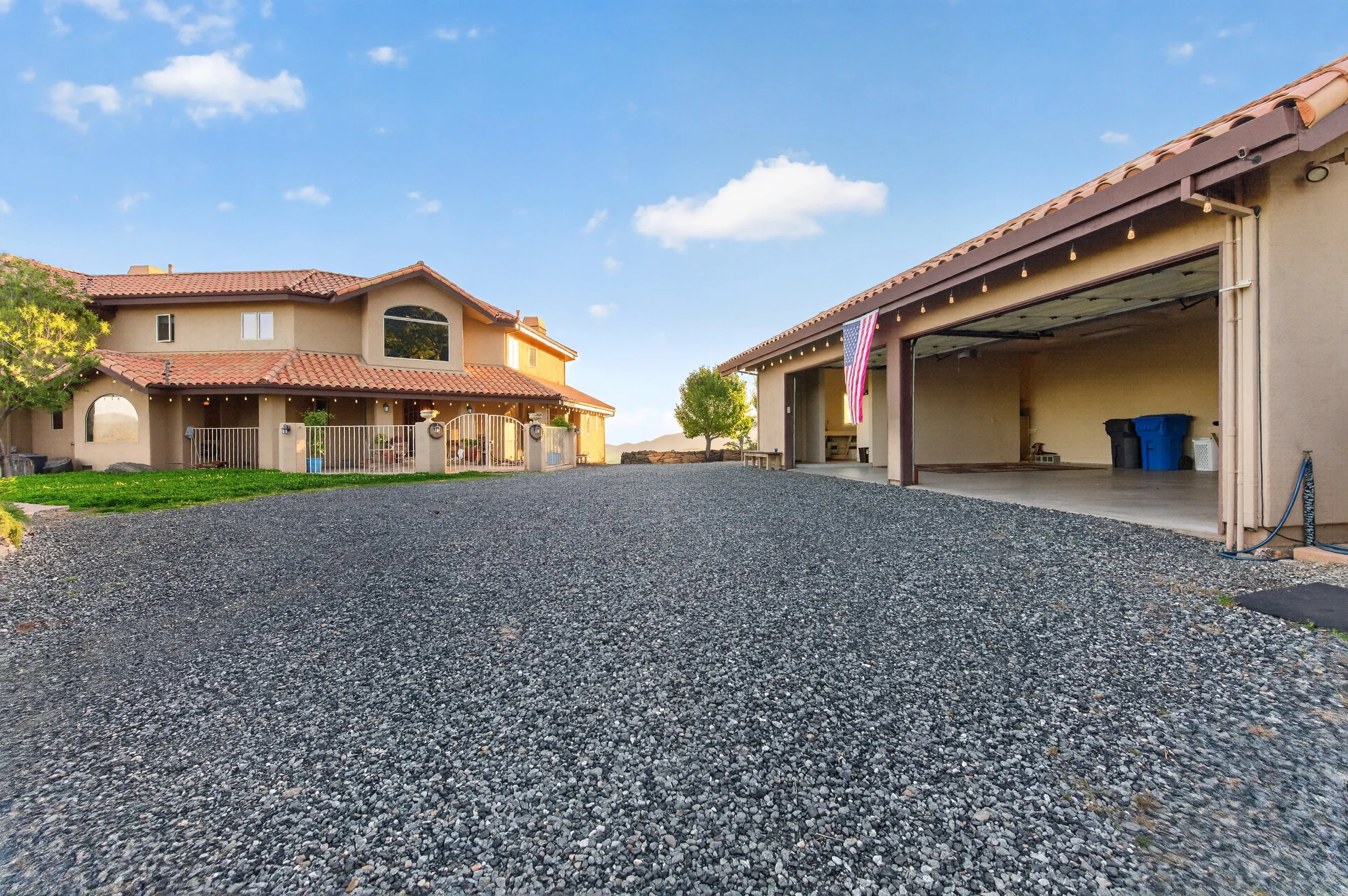 Mediterranean-style estate home in Vallecito California with arched windows, red tile roof, and private gated grounds