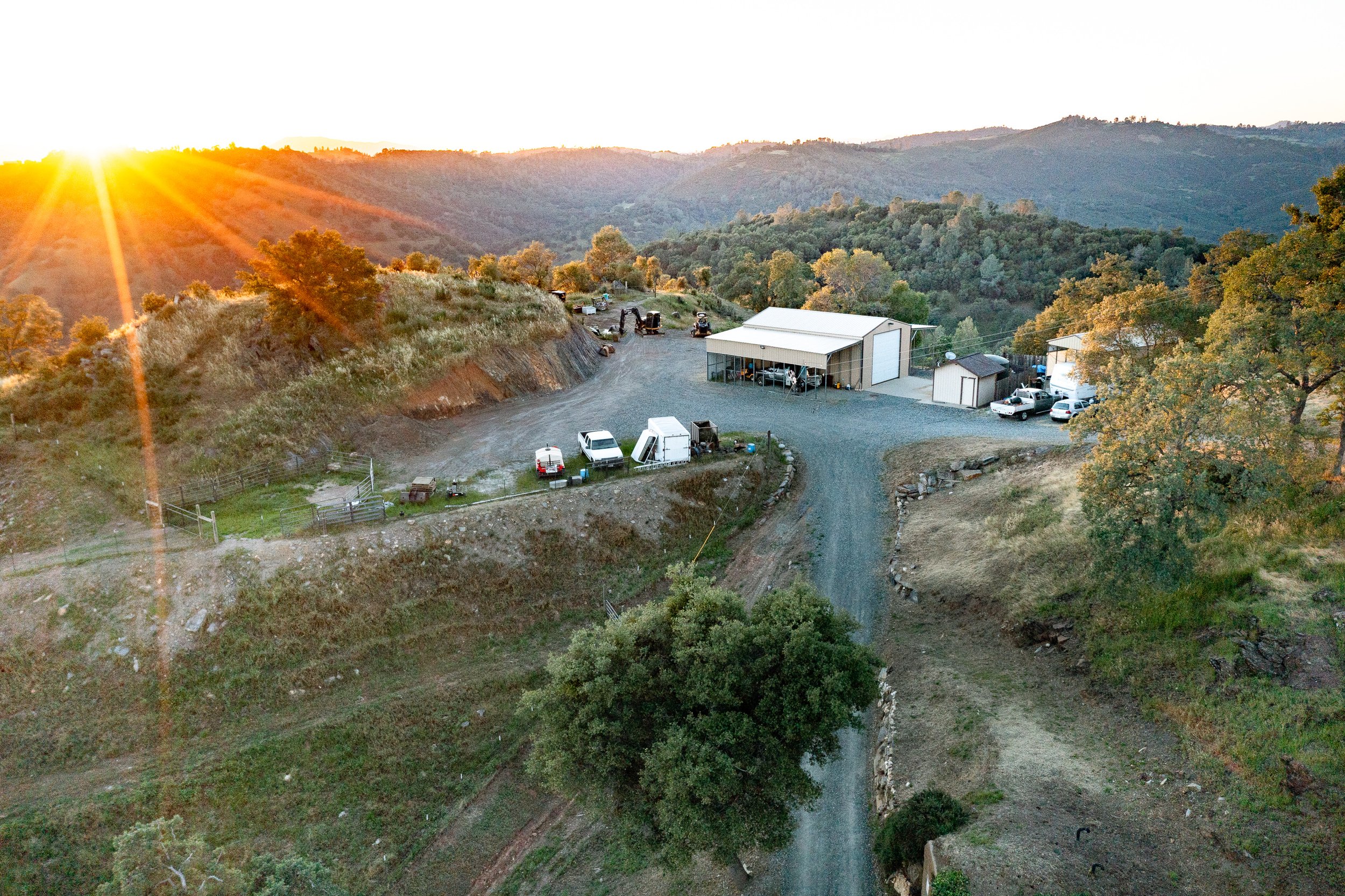 Sunset view over Airola Ranch in Vallecito California featuring rolling foothills, private ranch roads, and scenic Sierra Nevada mountain landscapes