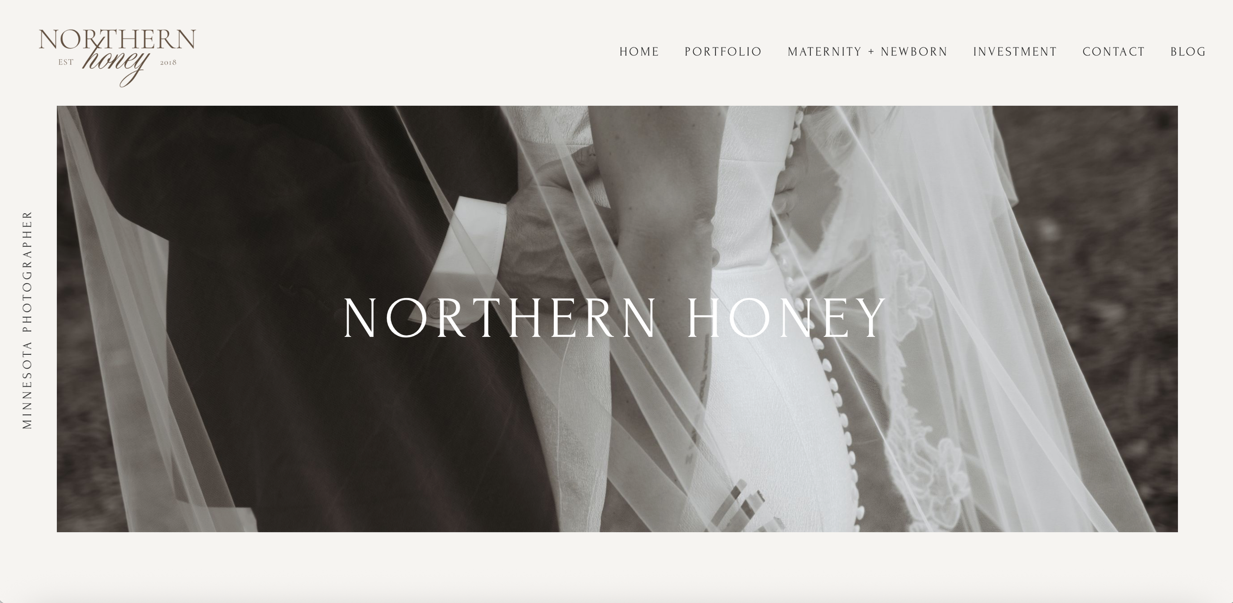 Homepage of Northern Honey photography website featuring a black-and-white wedding photo with a bride and groom holding hands, the bride in a white dress with button details and a veil, the groom in a dark suit, with a navigation menu at the top and the logo on the upper left.