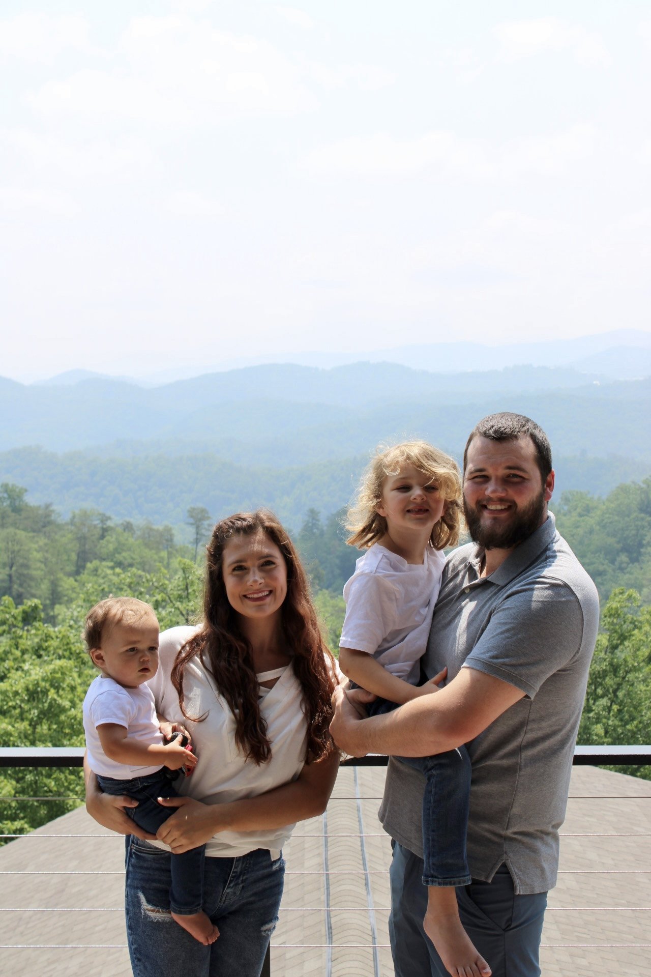 Randall McGuirt with his family in the mountains.