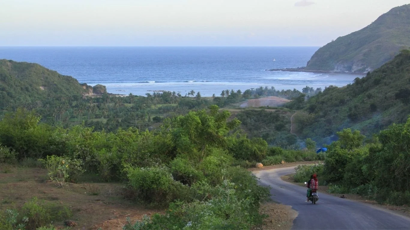 Scenic scooter ride through the hills of South Lombok with coastal views near Kuta Lombok.