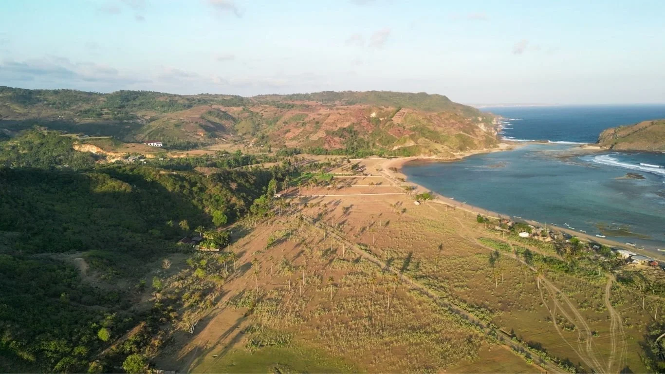 Aerial view of Are Guling Beach on Lombok's south coast with rolling hills, coastline and turquoise water