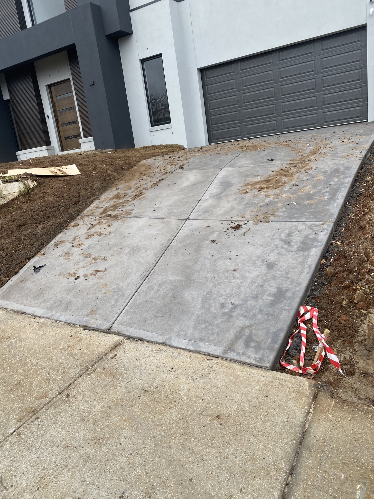 Dirty concrete driveway before professional pressure washing