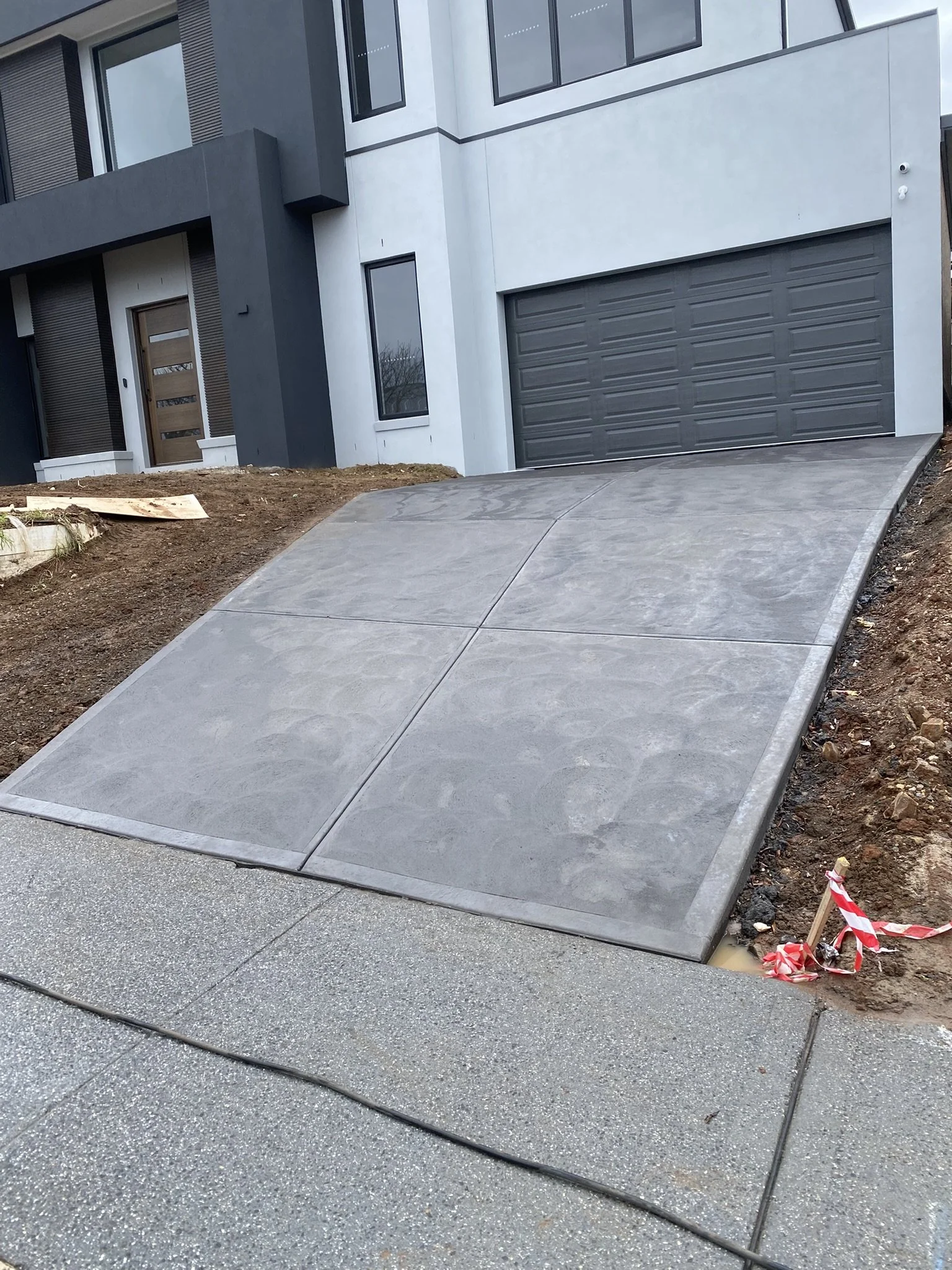 Clean residential concrete driveway in Melbourne’s north-east