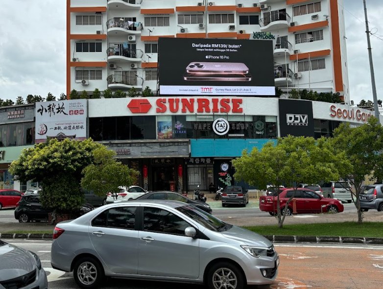 Medium format digital screen located strategically on Sunrise Building in Penang, near Gurney Plaza.